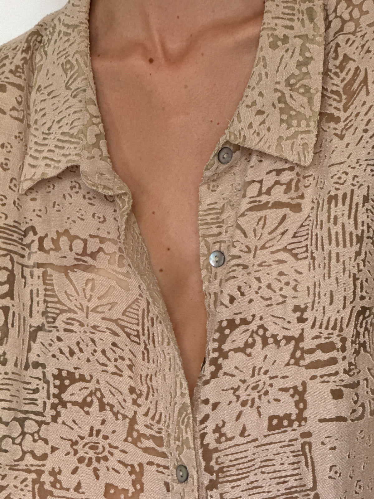 Oversized beige abstract burnout patterned button-up blouse