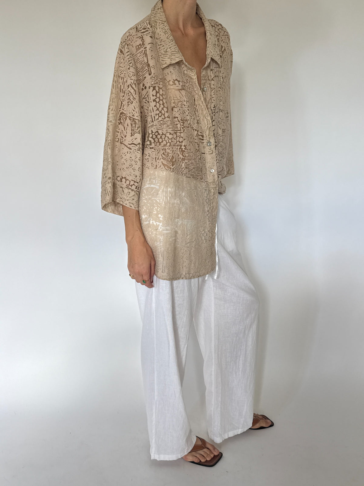 Oversized beige abstract burnout patterned button-up blouse