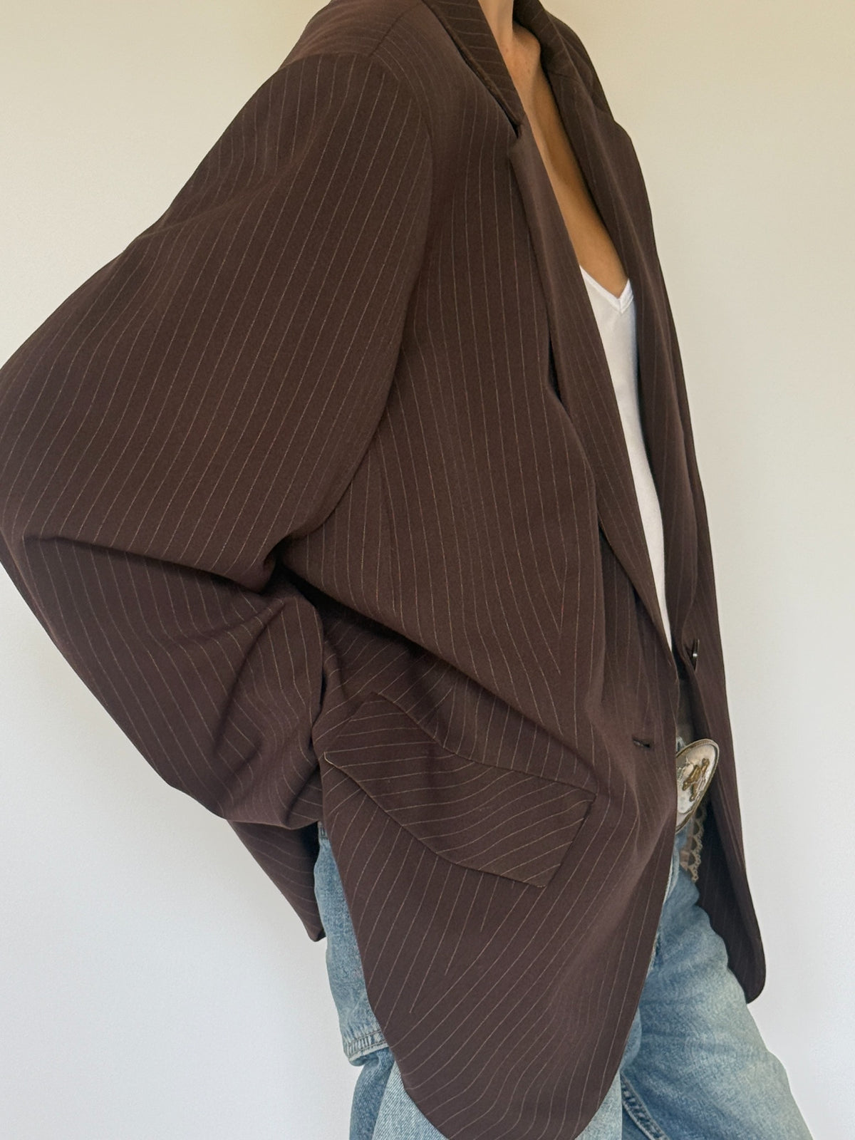 Vintage brown pinstripe blazer pocket and lapel detail