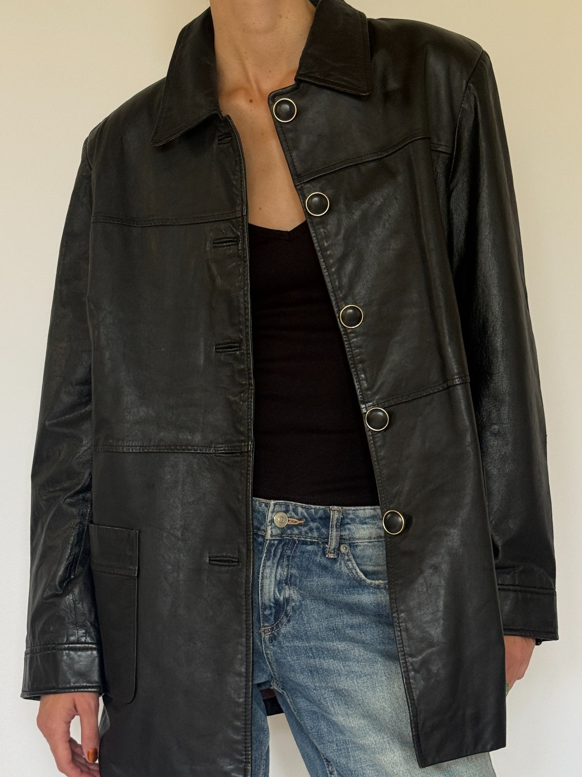 Vintage black leather jacket leather close-up