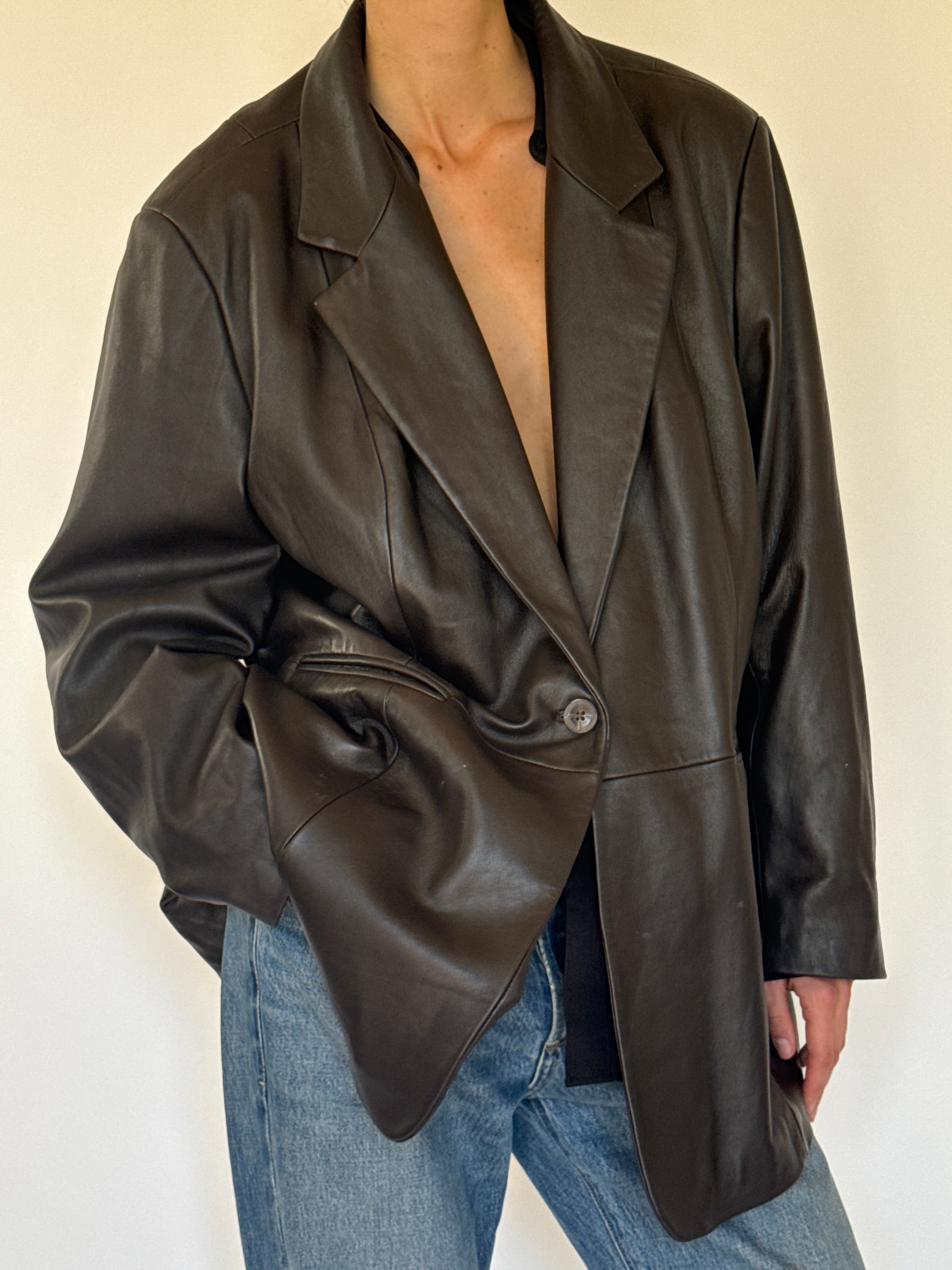 Vintage dark brown leather blazer lapel close-up
