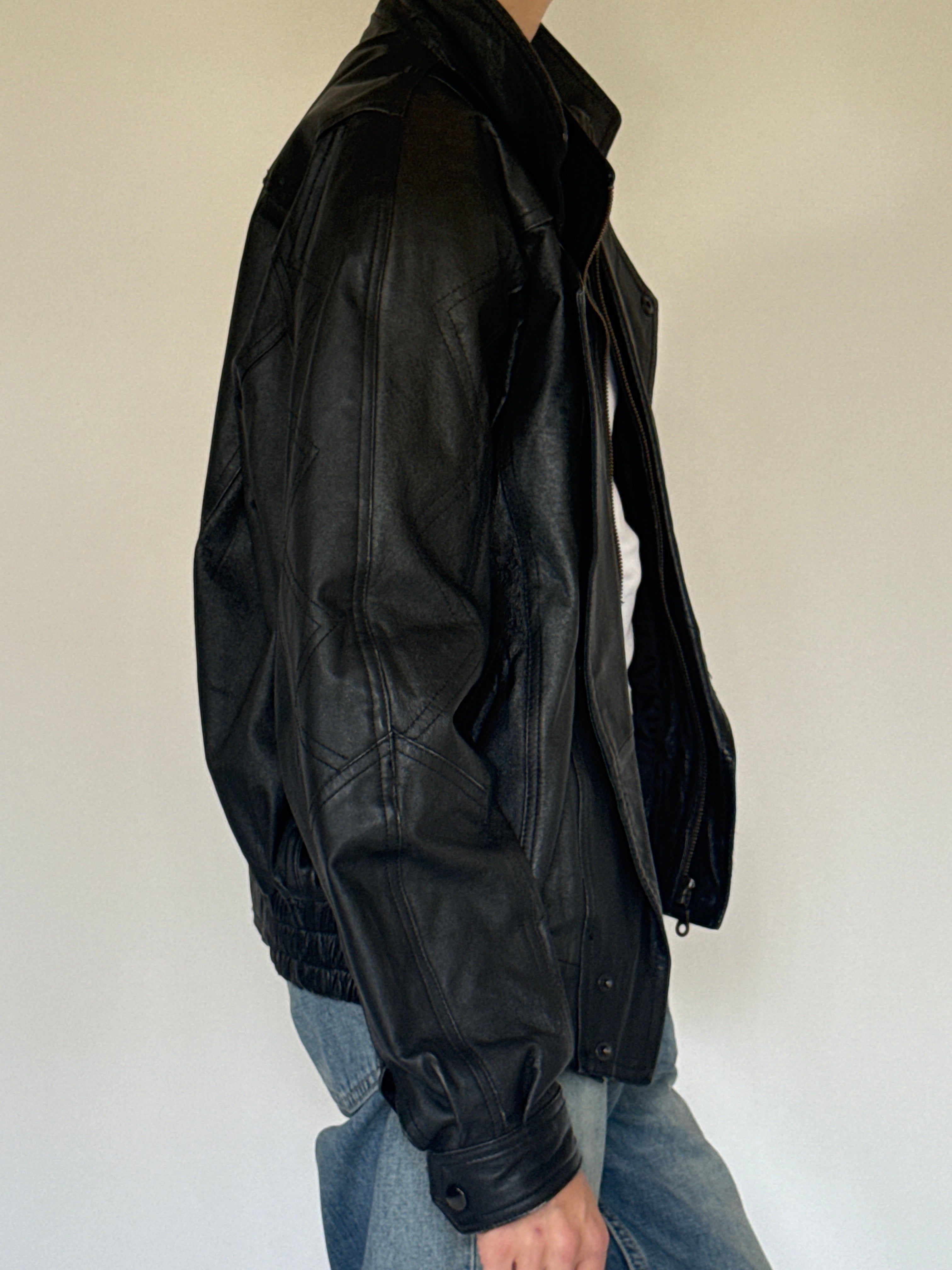 Vintage oversized black leather bomber jacket side view