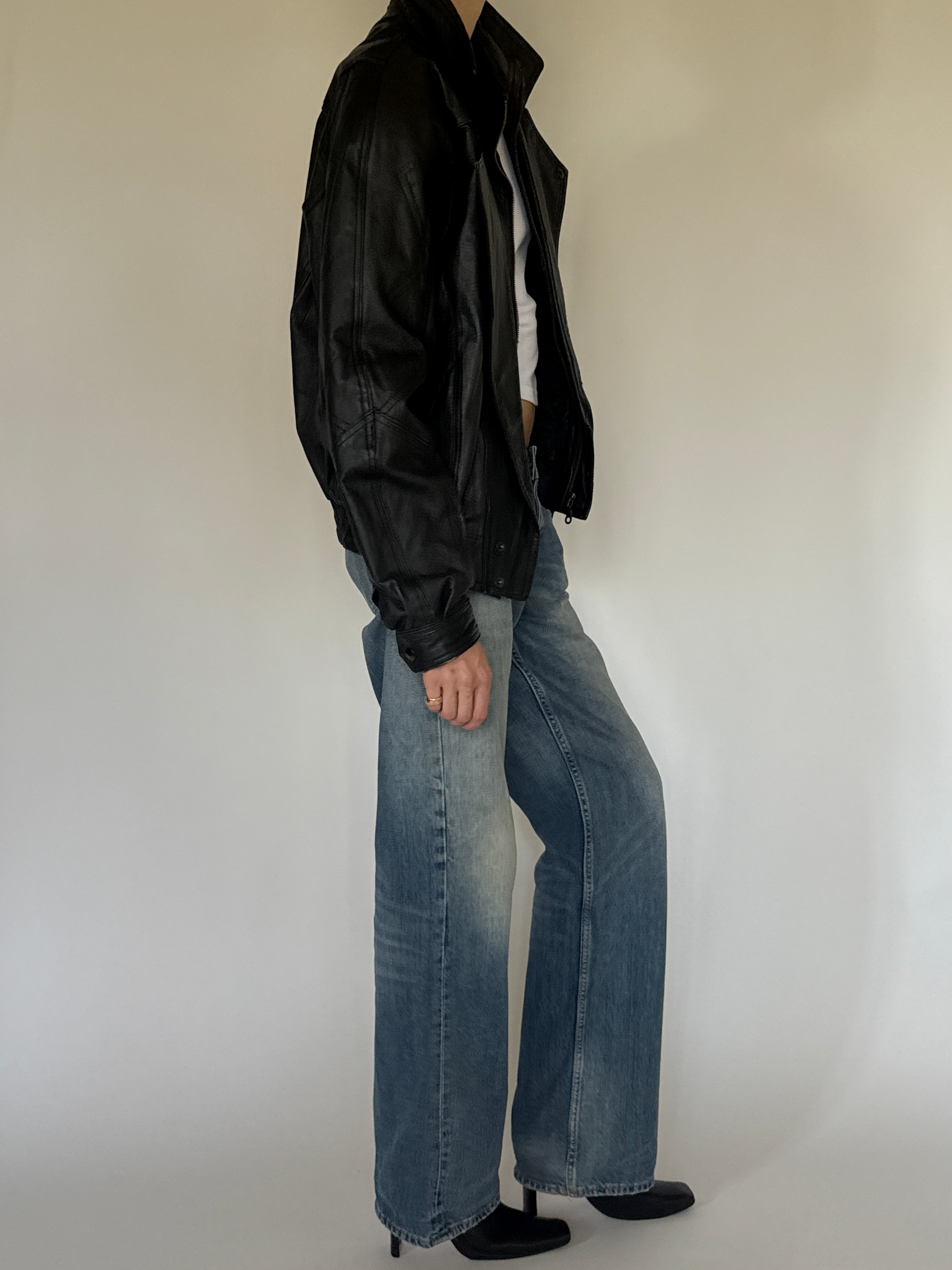 Vintage oversized black leather bomber jacket side view