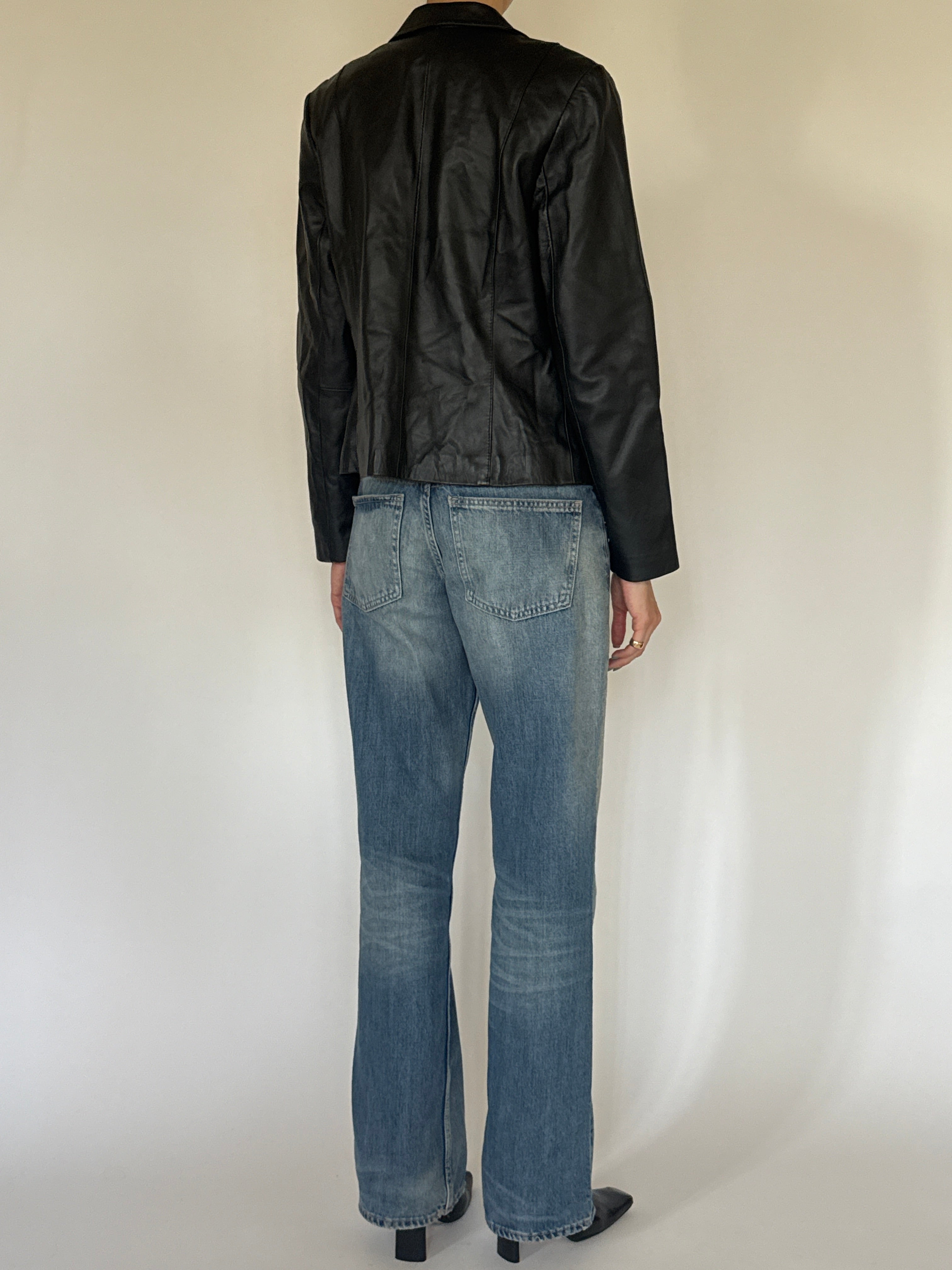 Vintage black leather jacket back view