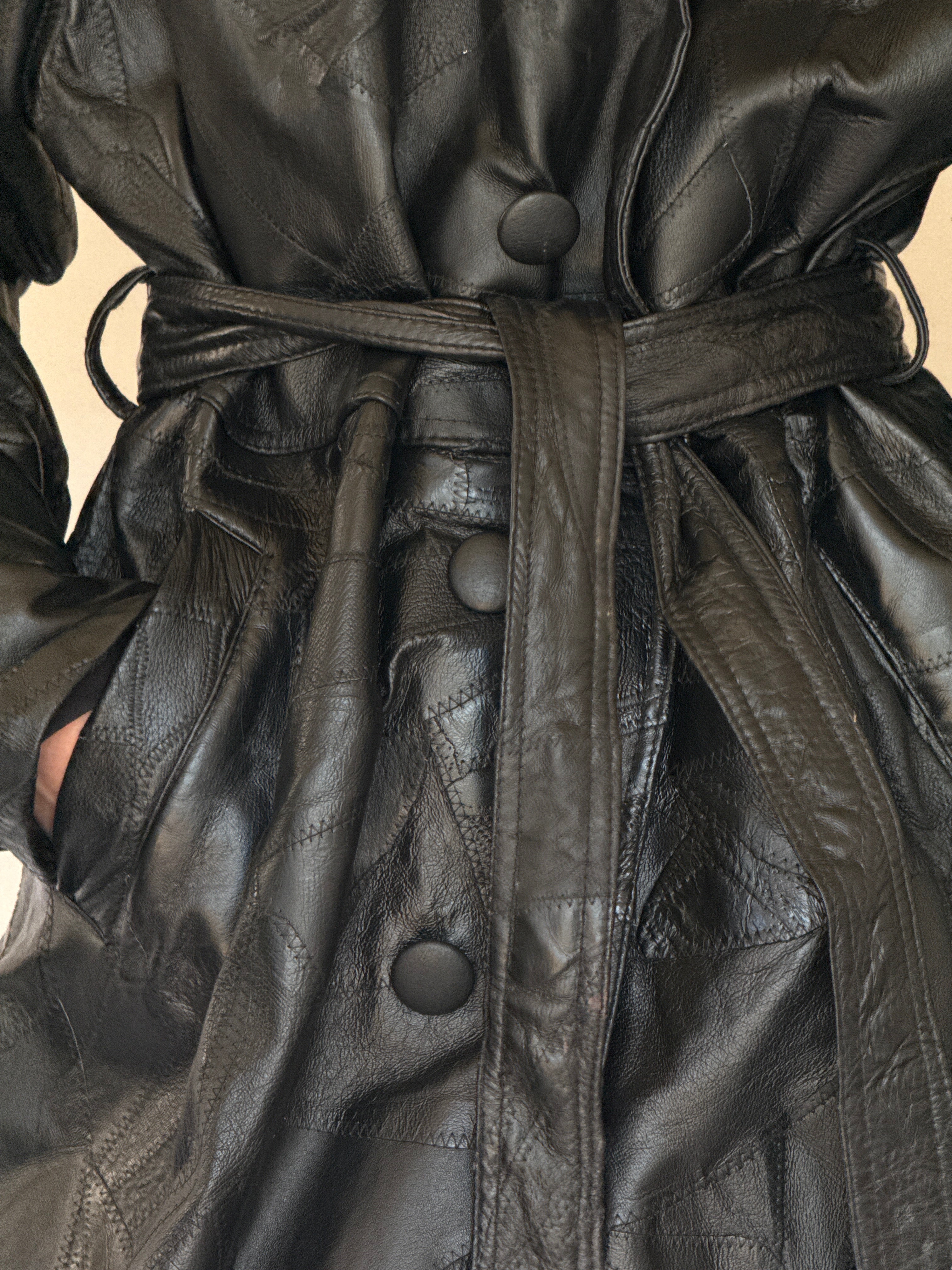 Vintage black leather trench coat leather texture close-up