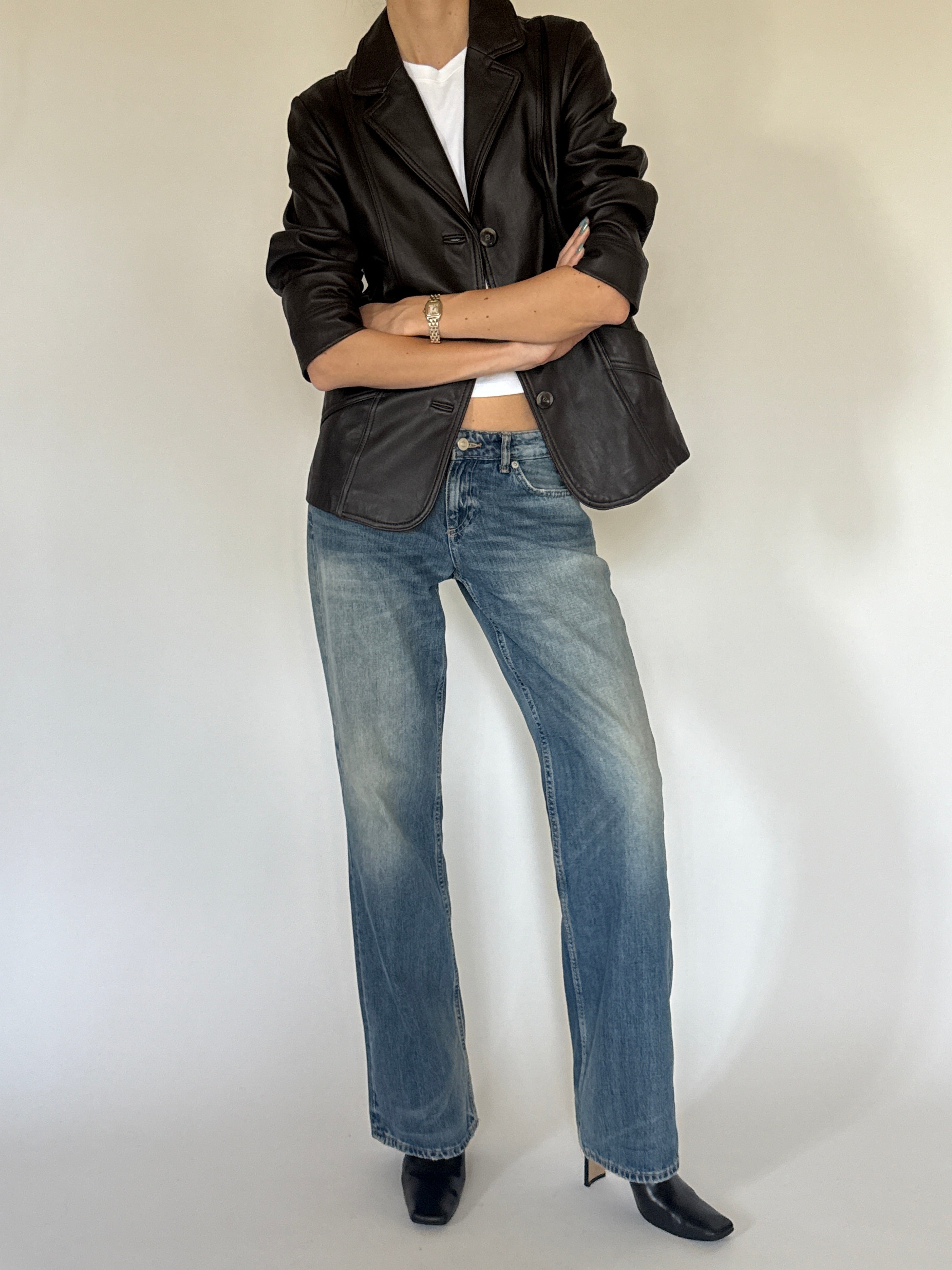 Vintage dark brown leather blazer styled with denim