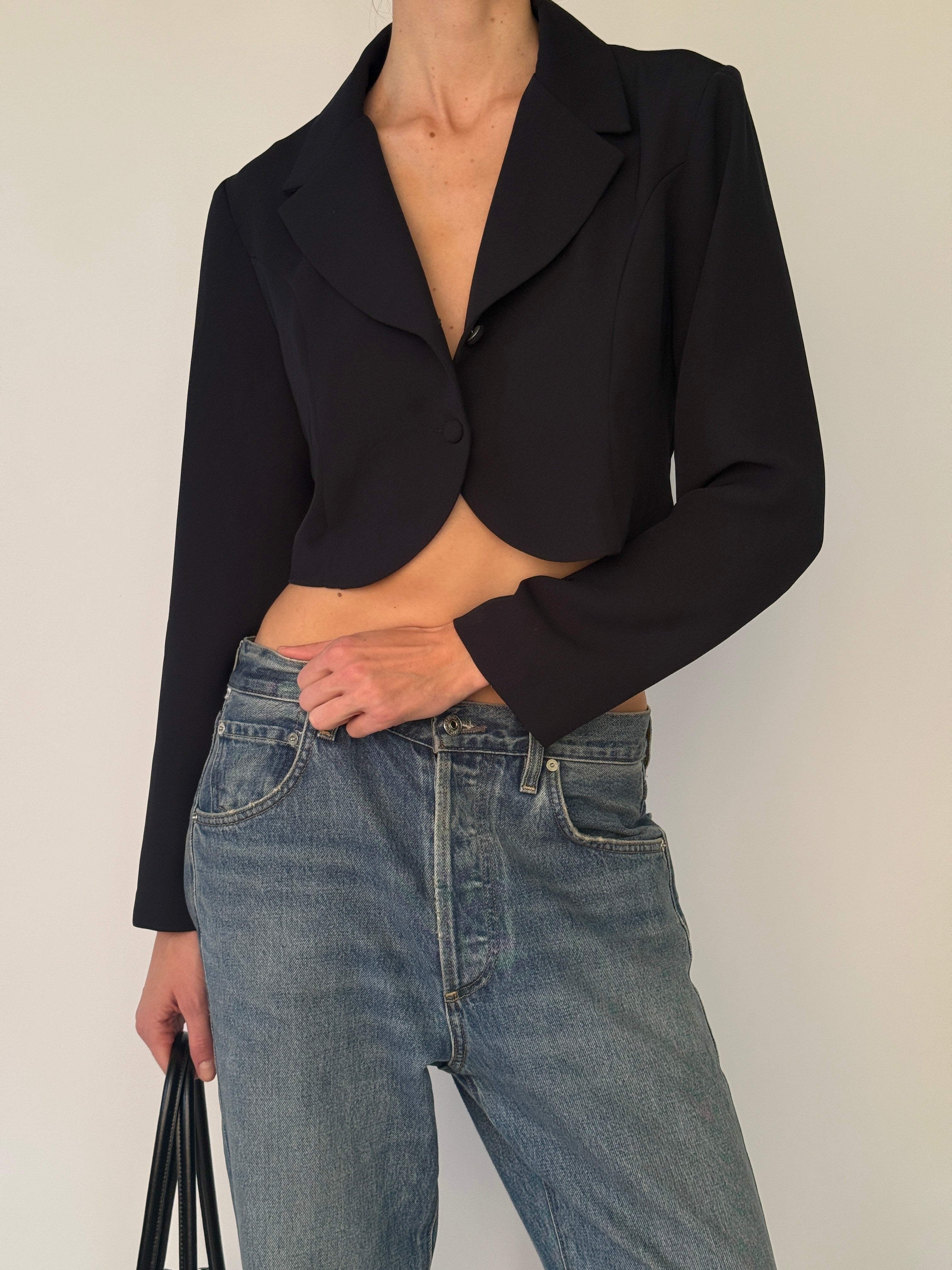 Vintage cropped blazer with notch lapel and button-front closure in black