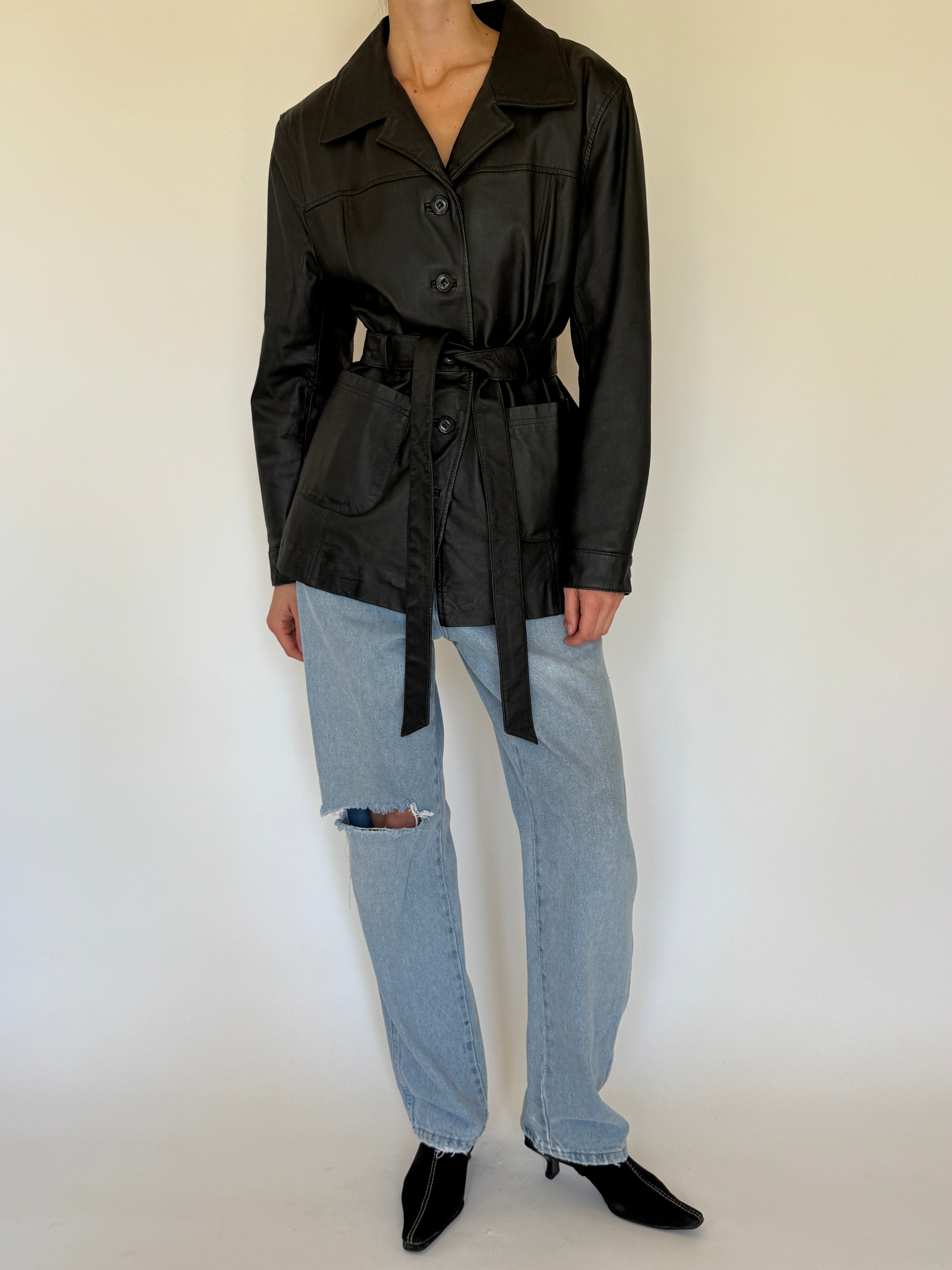 Vintage black leather jacket front view belted silhouette
