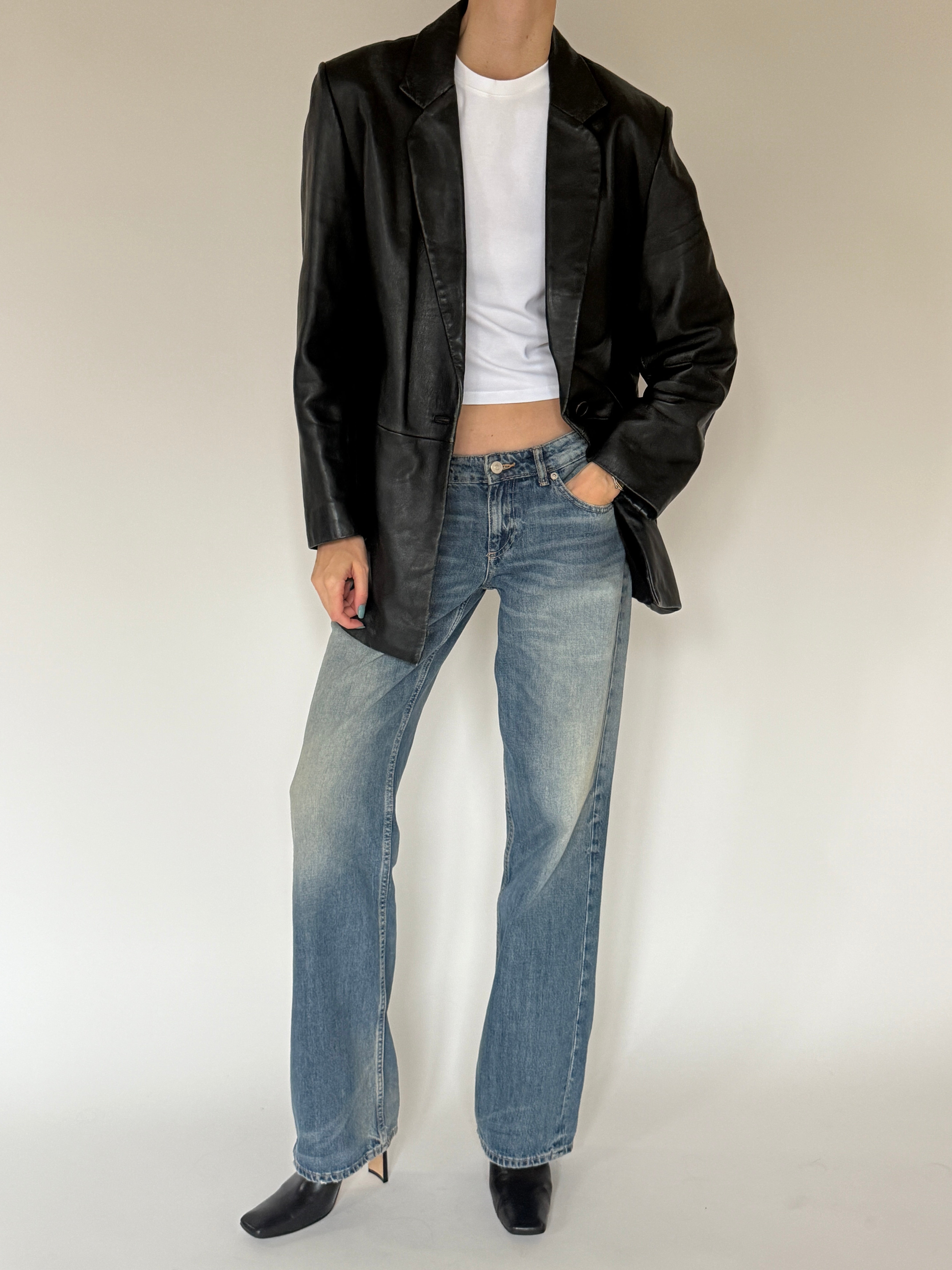 Vintage black leather blazer front view with single-button closure