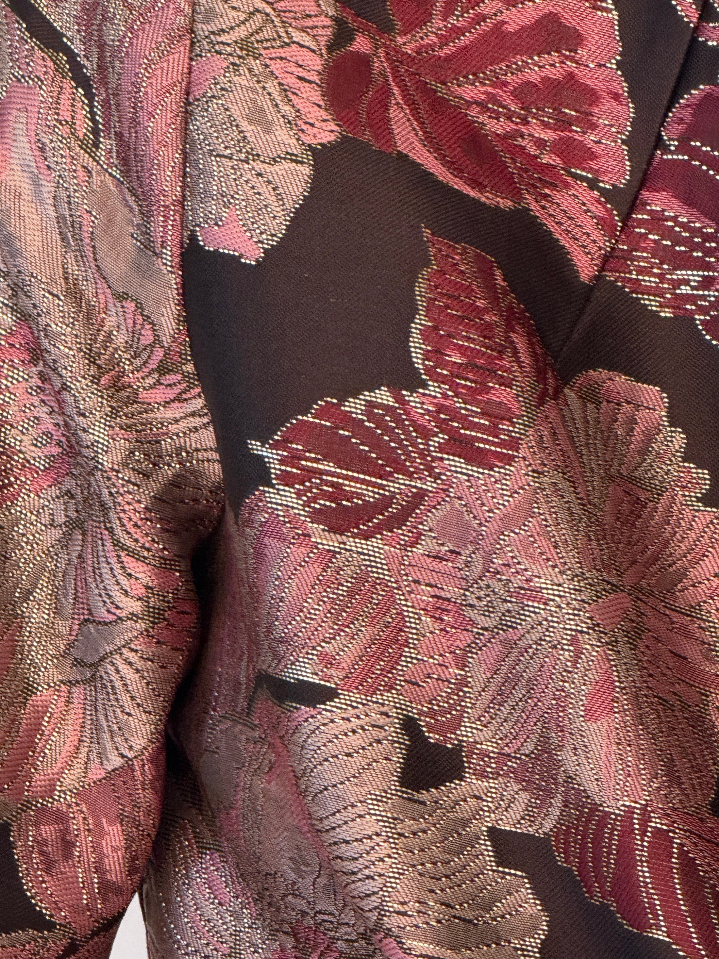 Close-up of floral brocade fabric on vintage jacket