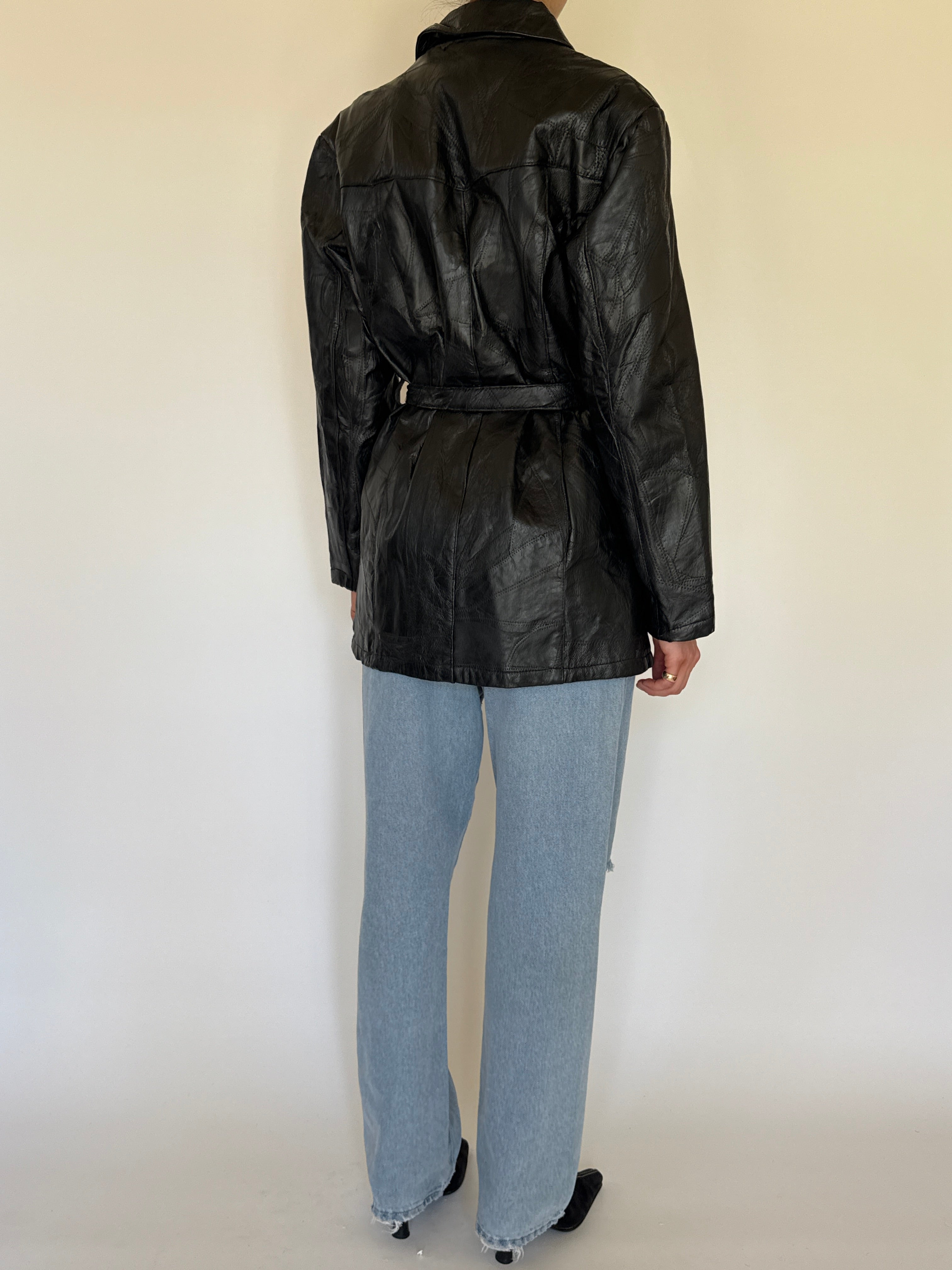 Vintage patchwork leather belted jacket black back view