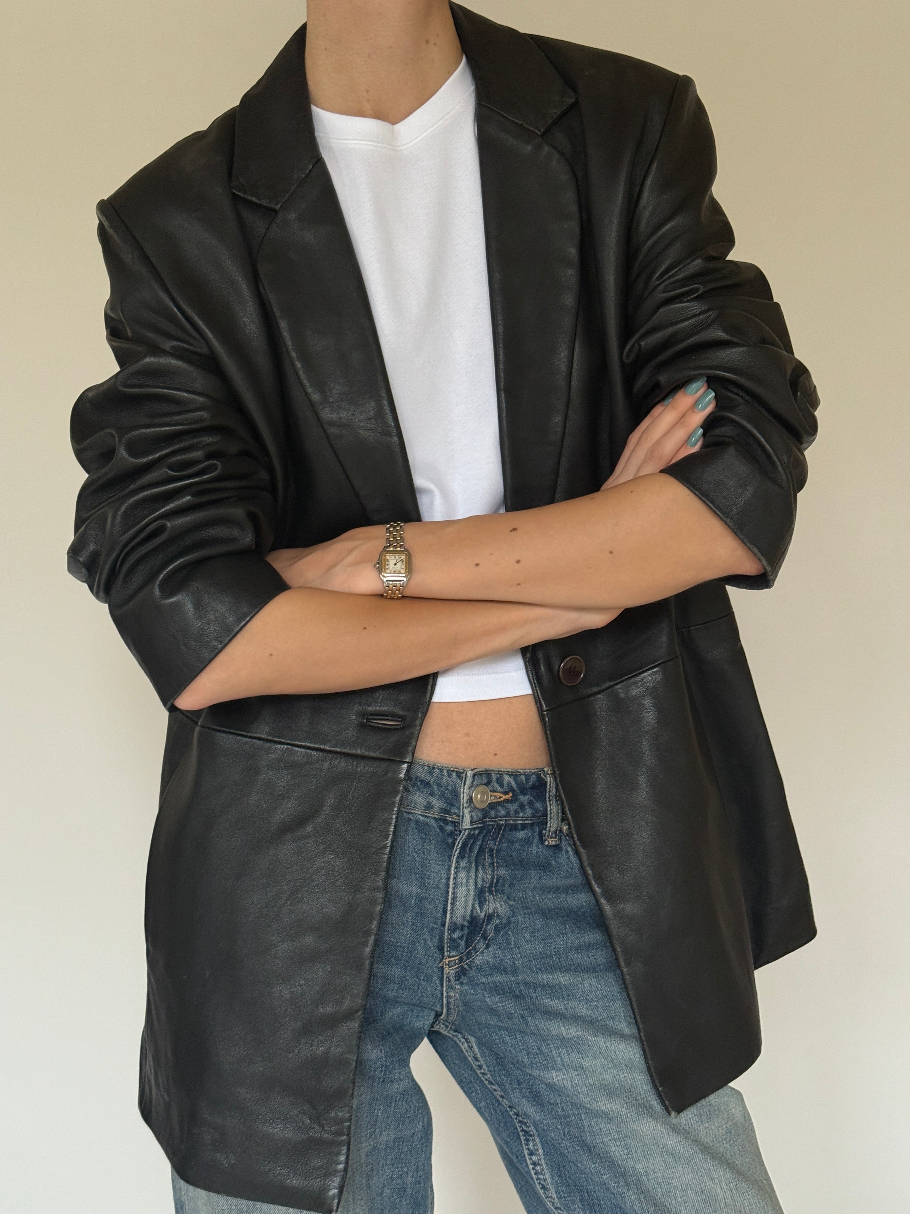 Vintage notch lapel collar detail in black leather