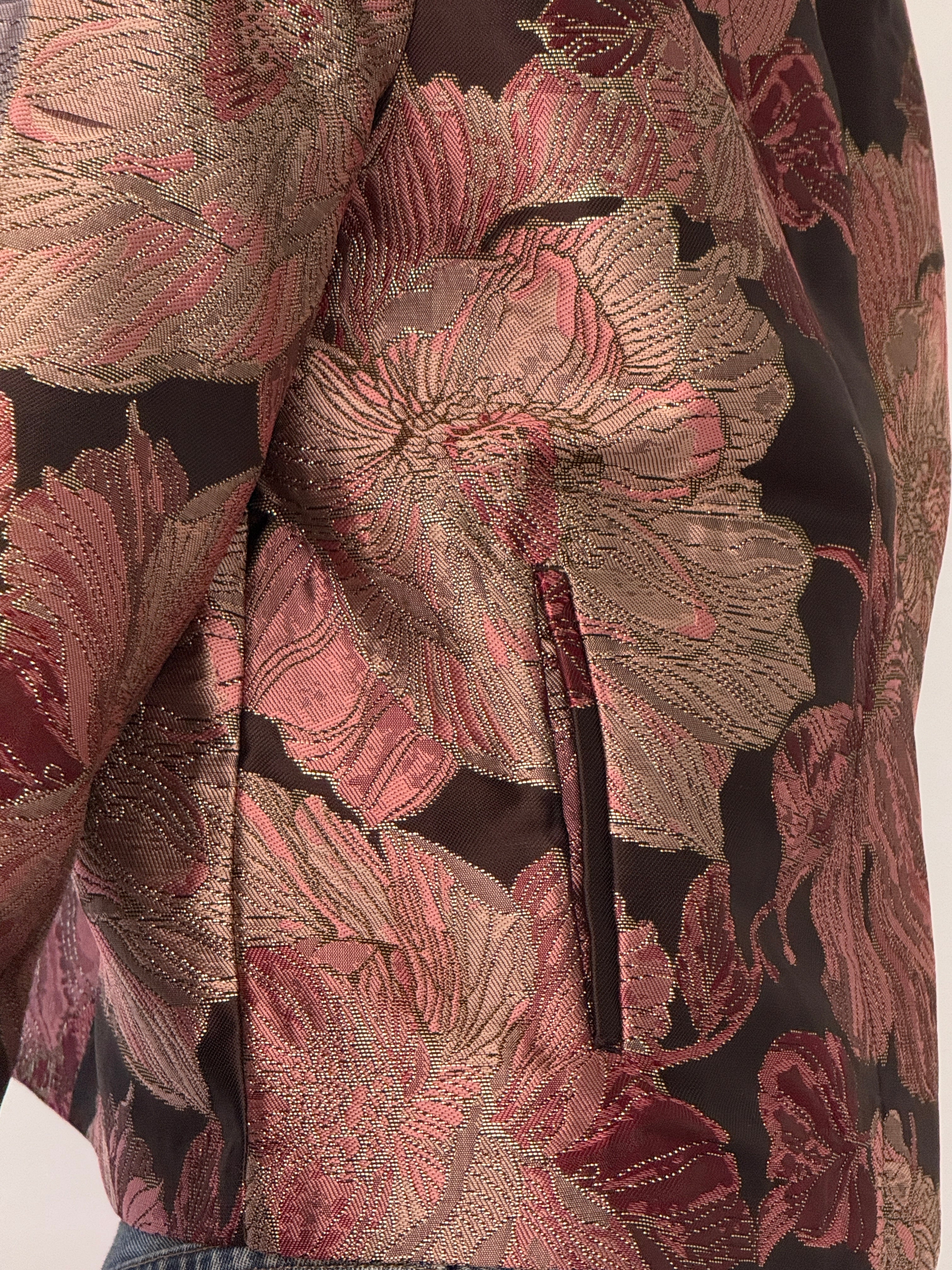 Close-up of floral brocade fabric on vintage jacket
