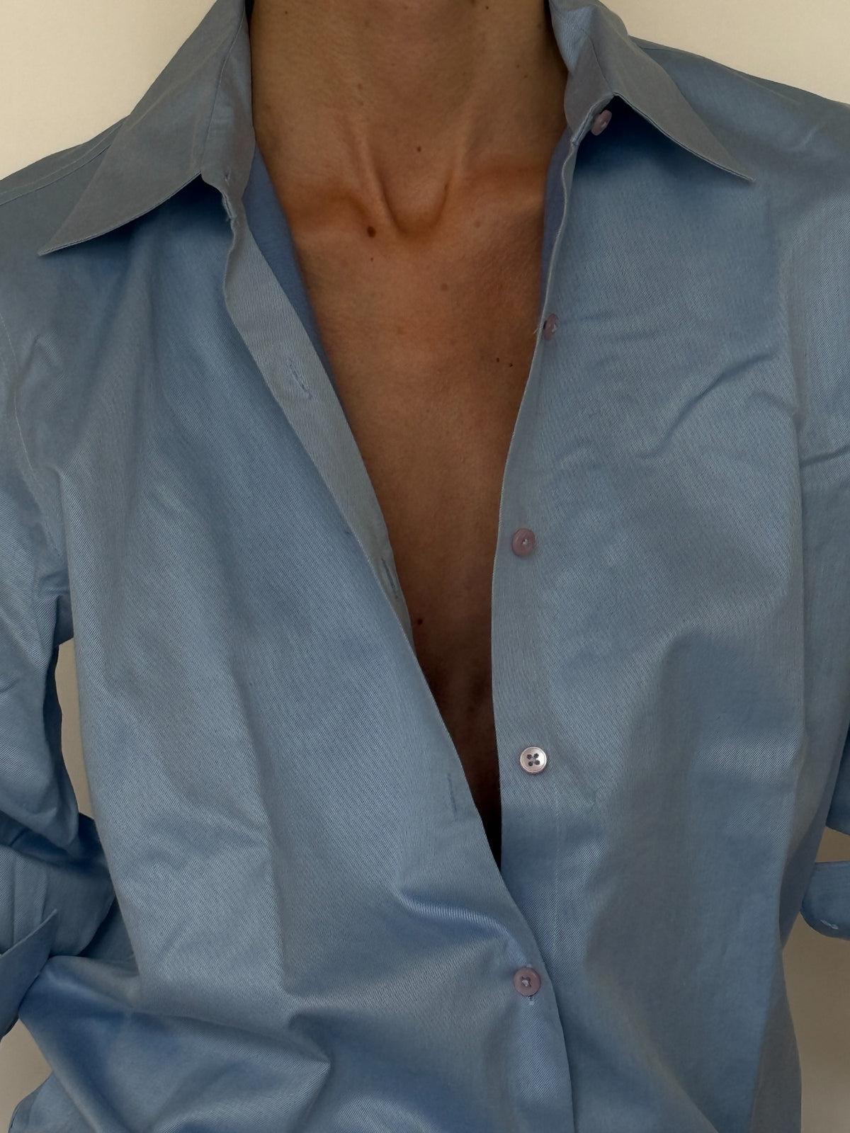 Vintage light blue button-up shirt collar and button detail