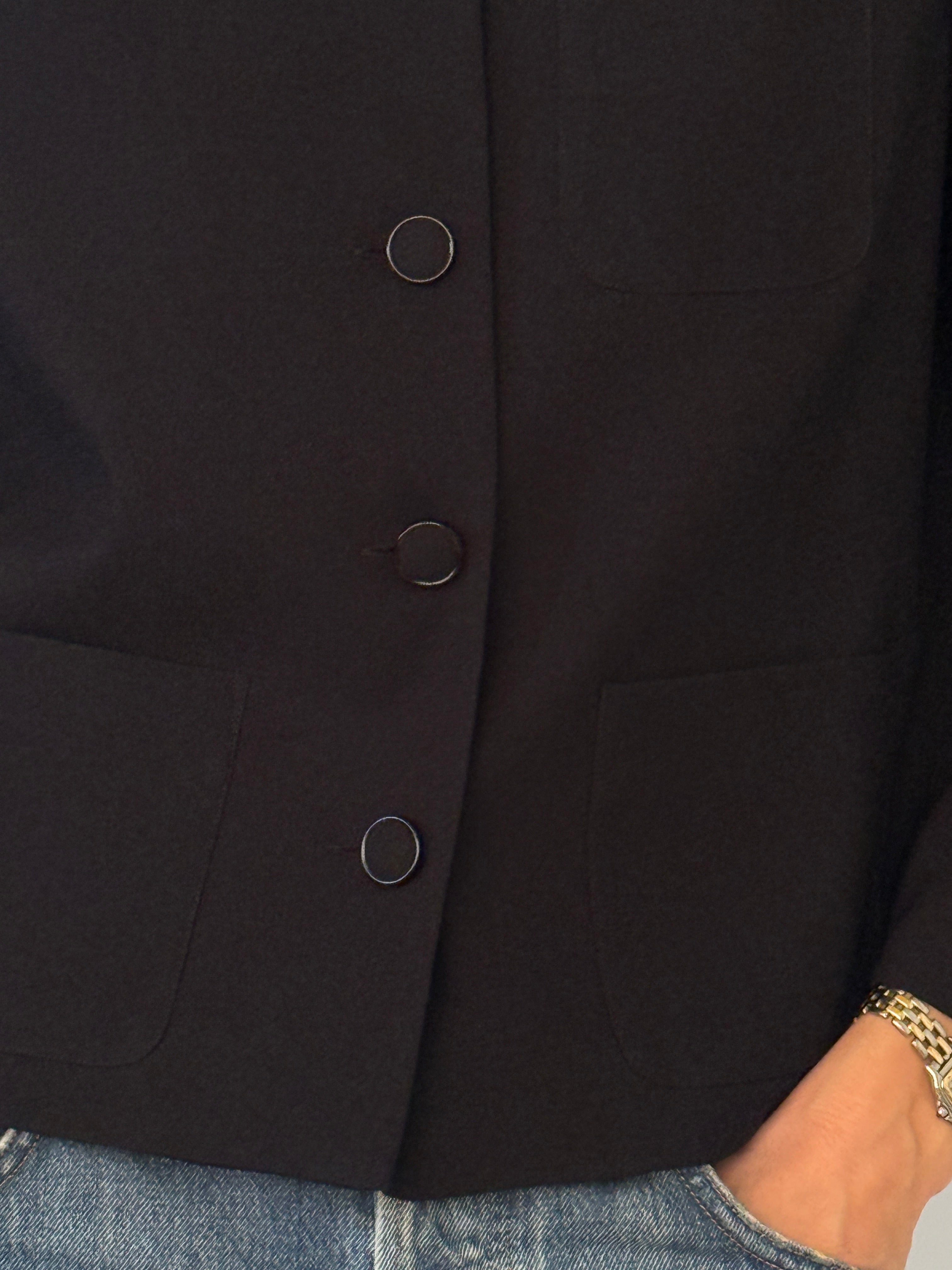Vintage black collarless jacket button detail