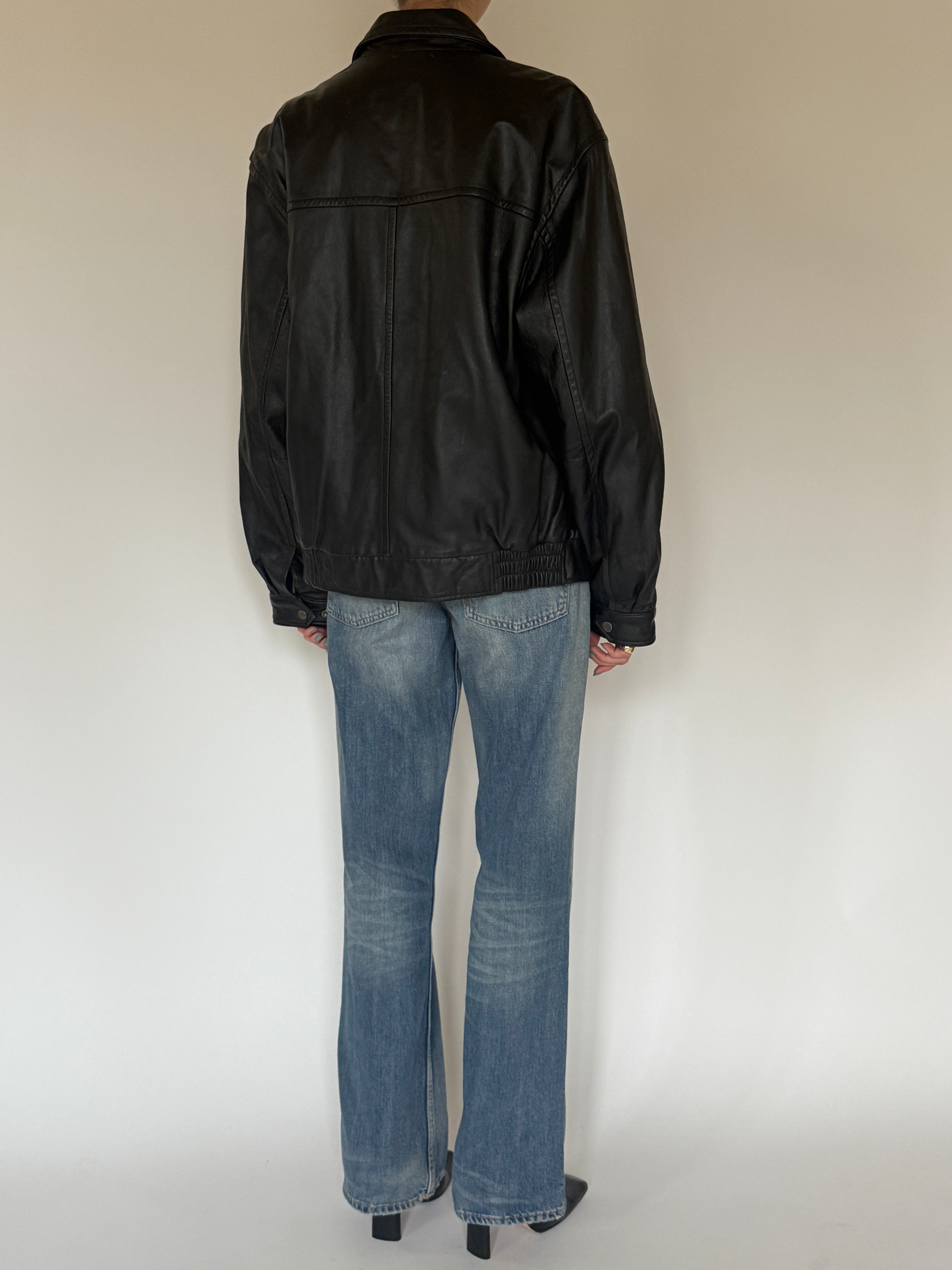 Vintage black leather jacket back view