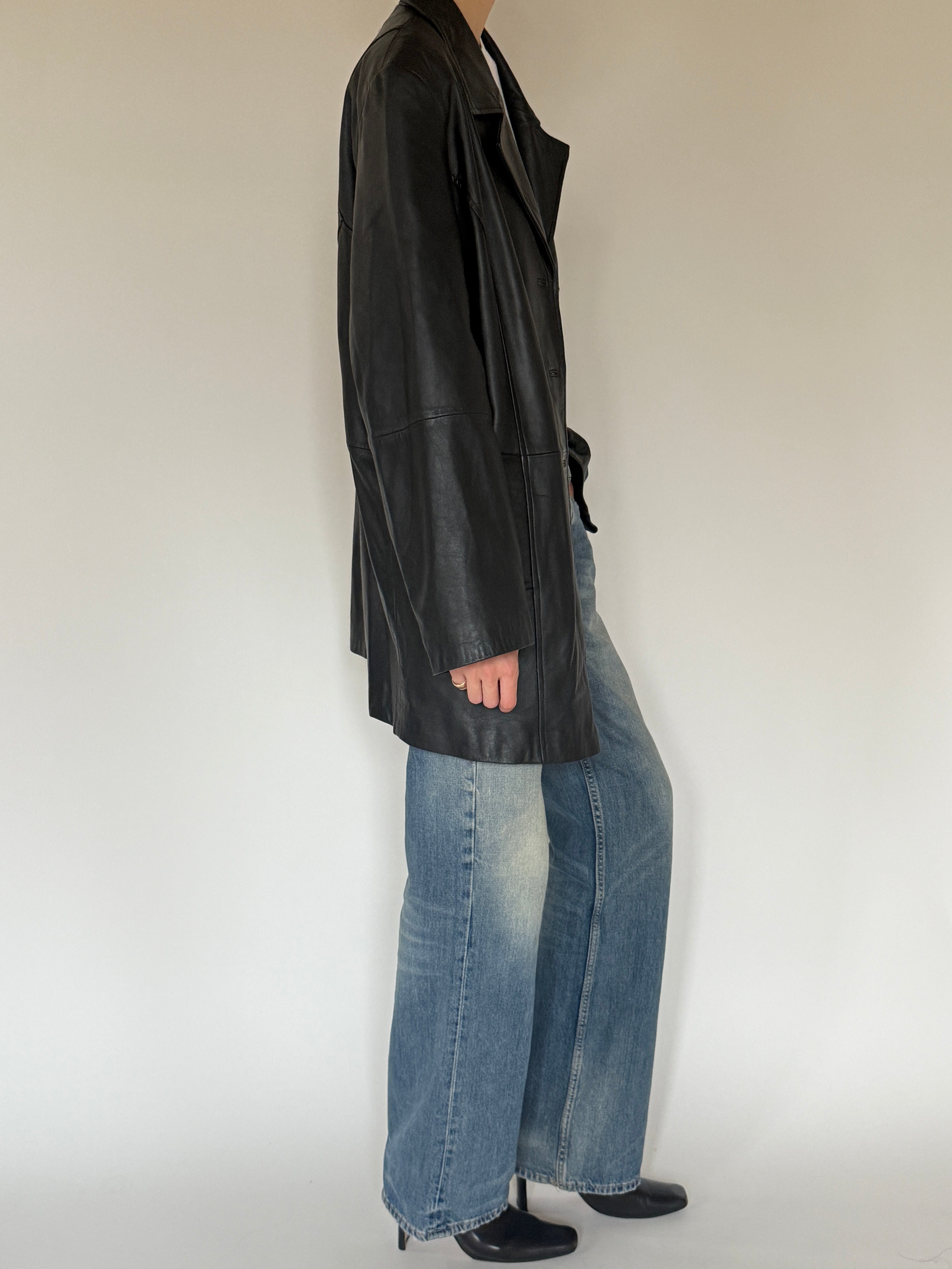 Vintage black leather jacket side view