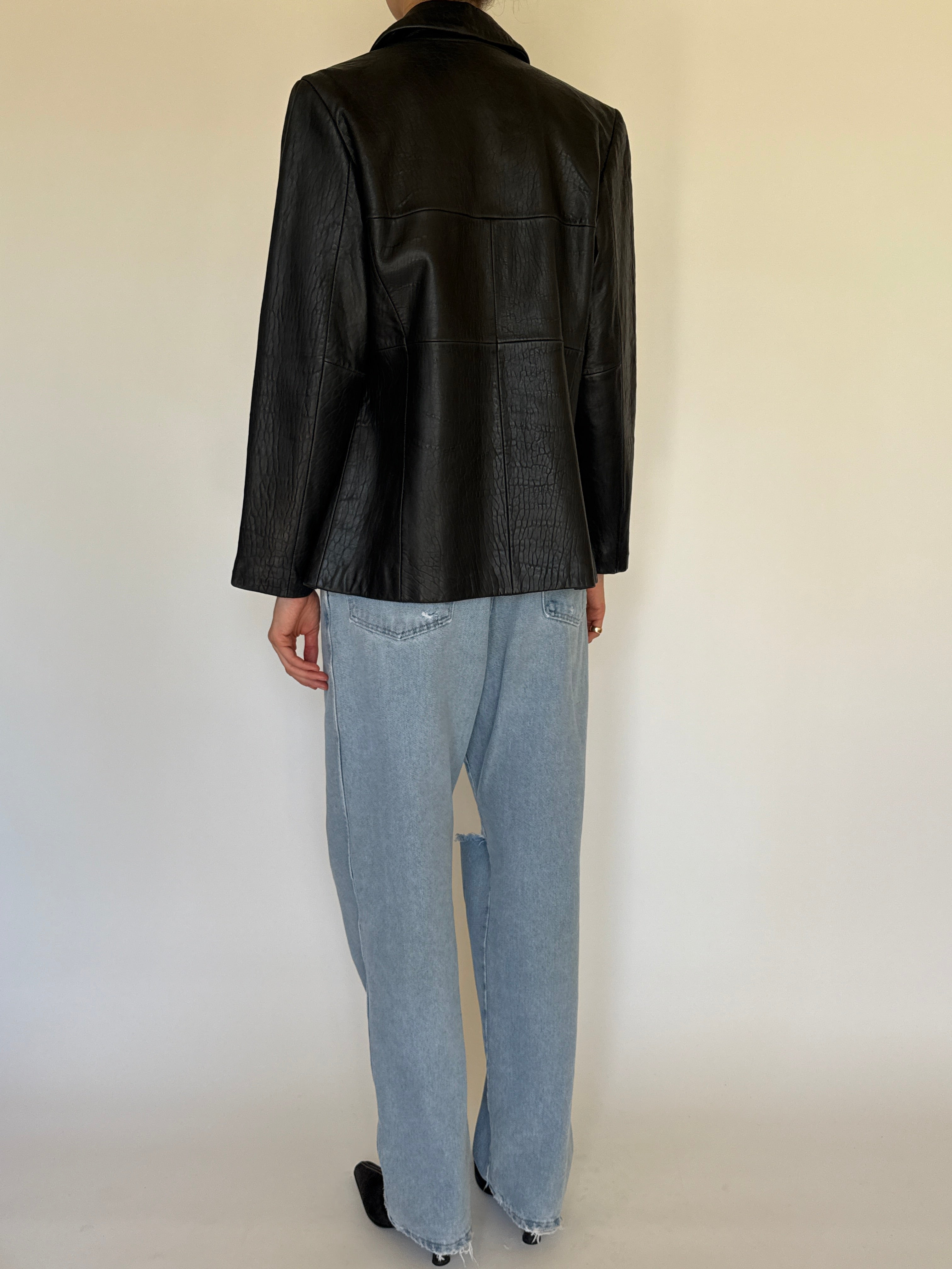 Vintage black leather jacket back view clean design