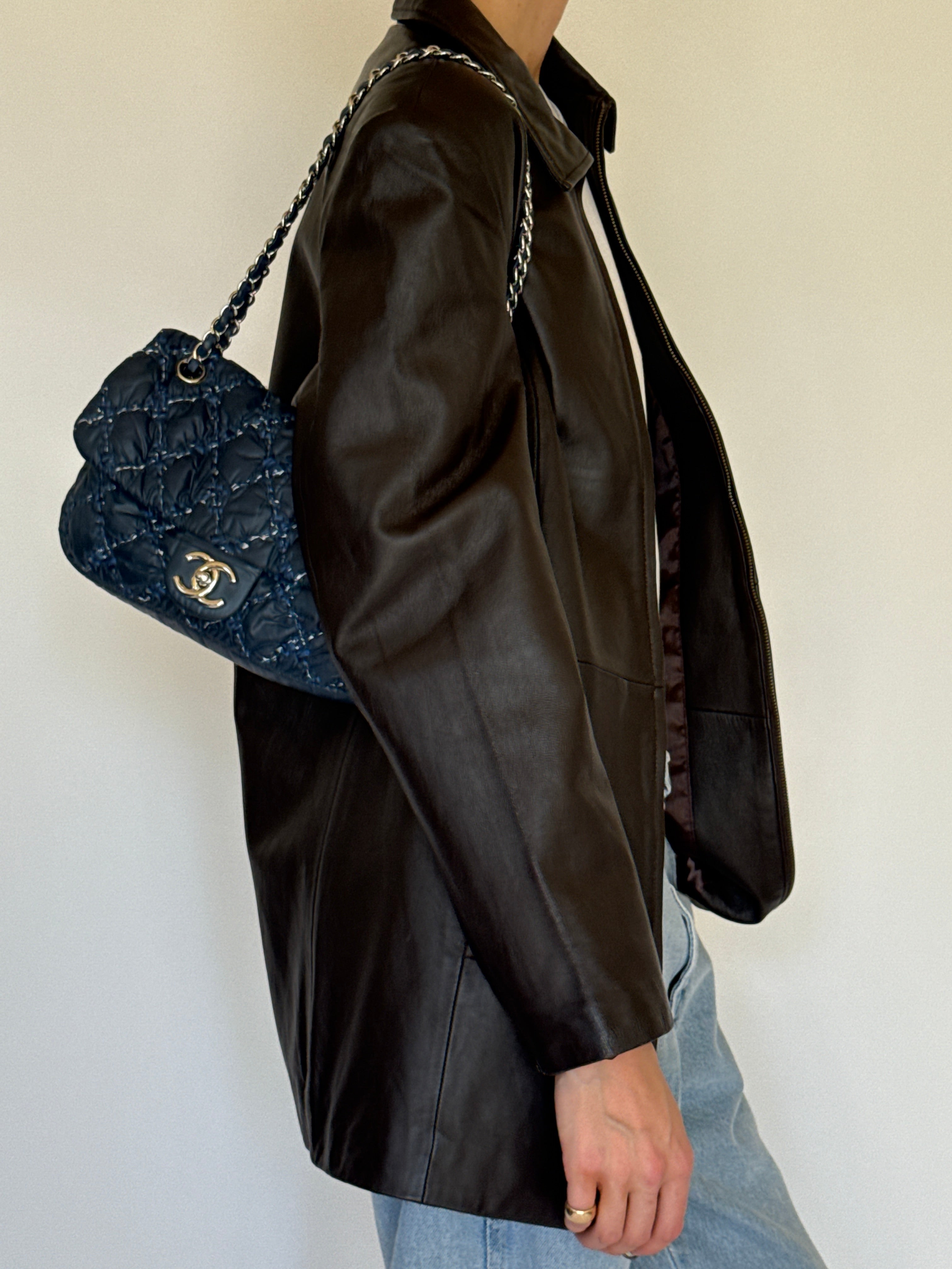 Vintage dark brown leather jacket side view