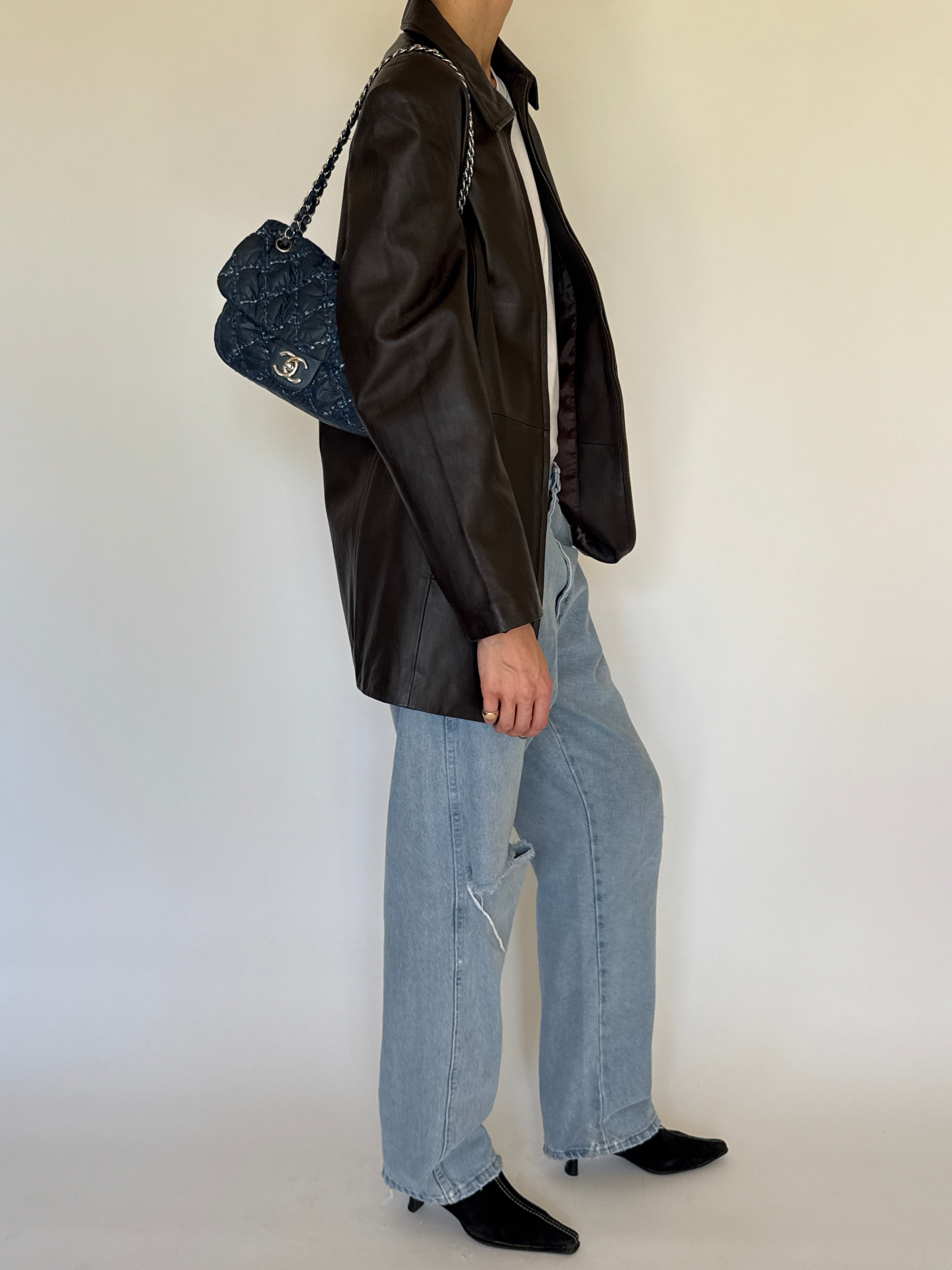 Vintage dark brown leather jacket side view