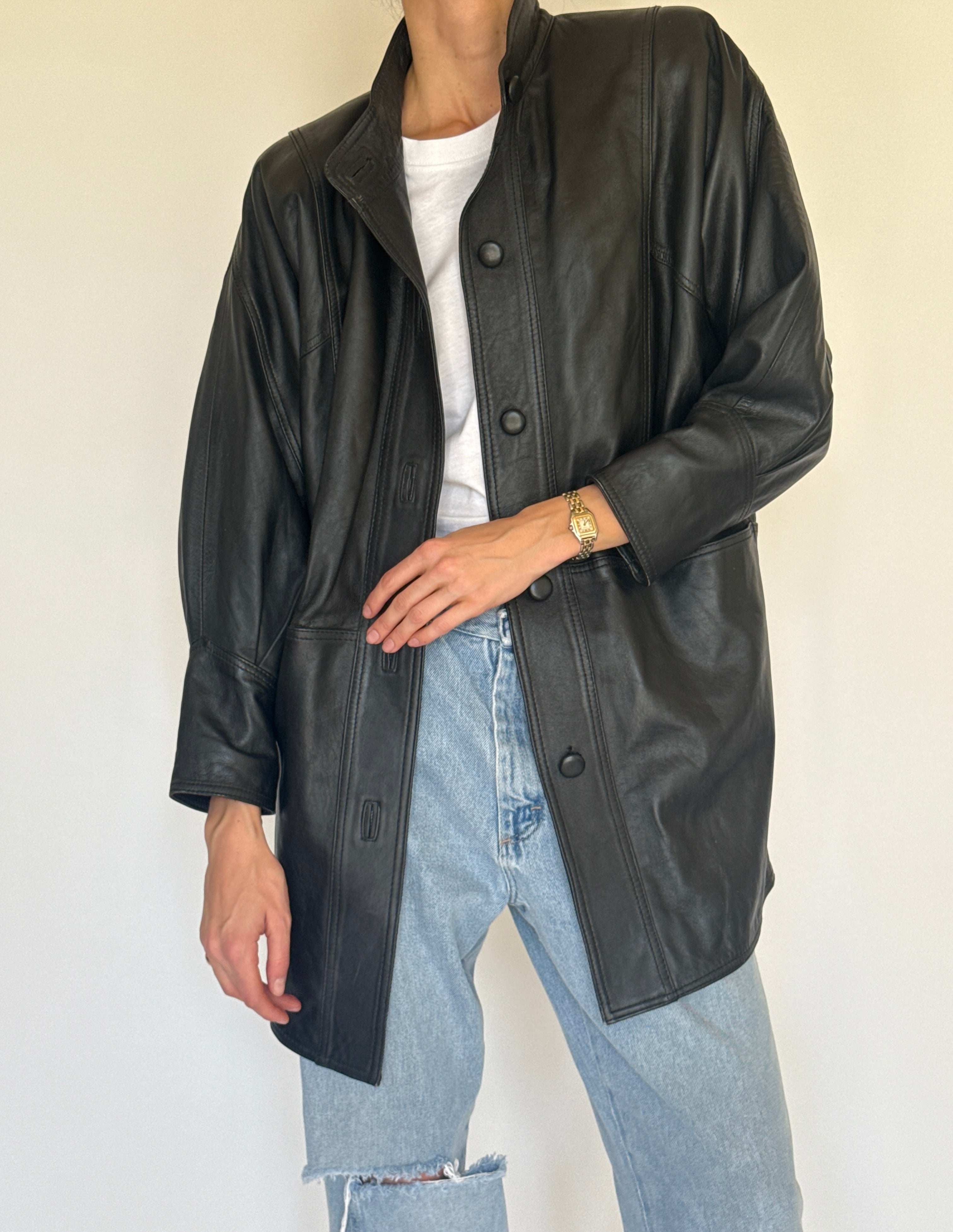 Vintage black leather jacket close-up of leather texture