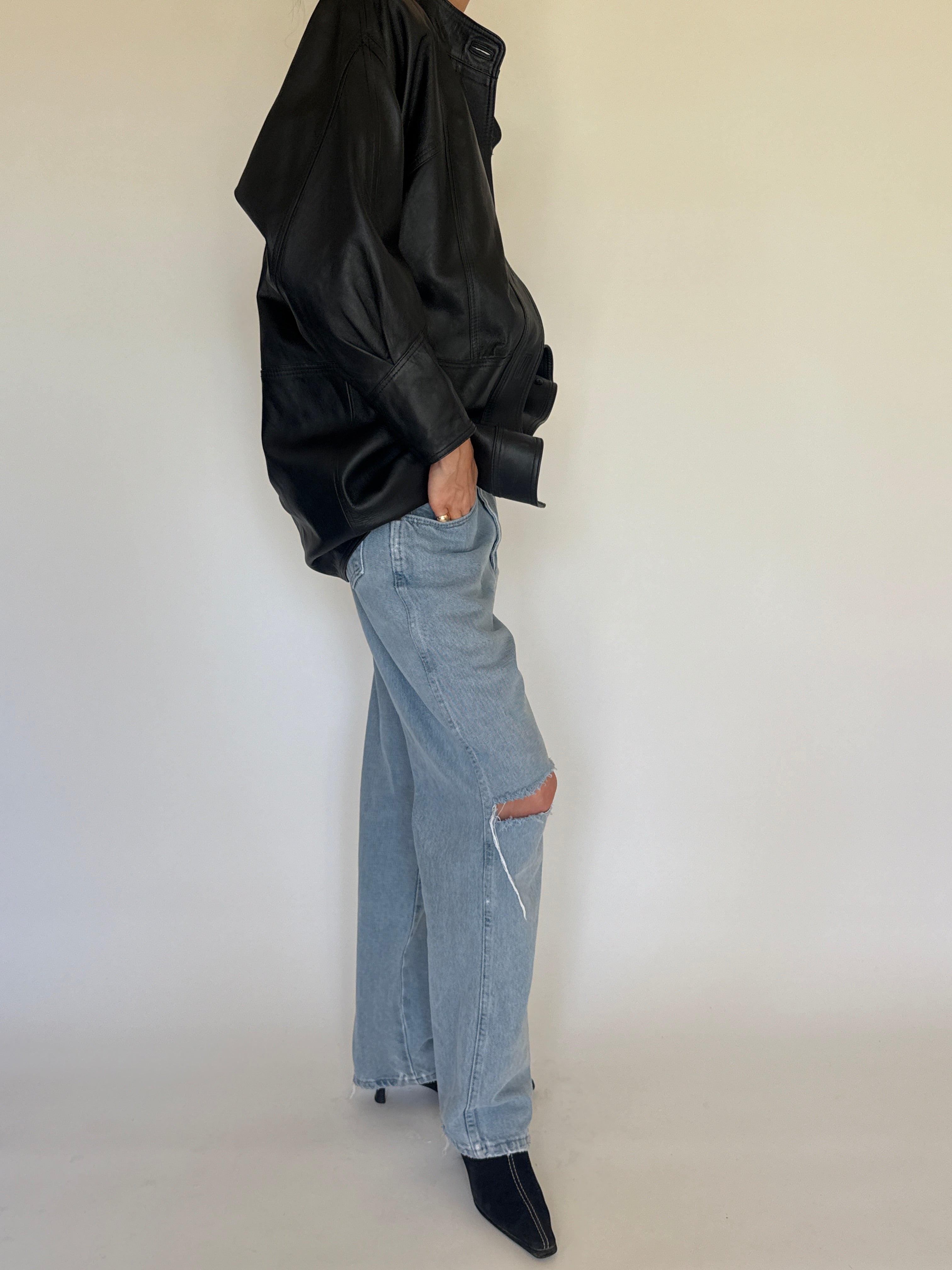 Vintage black leather jacket oversized silhouette side view