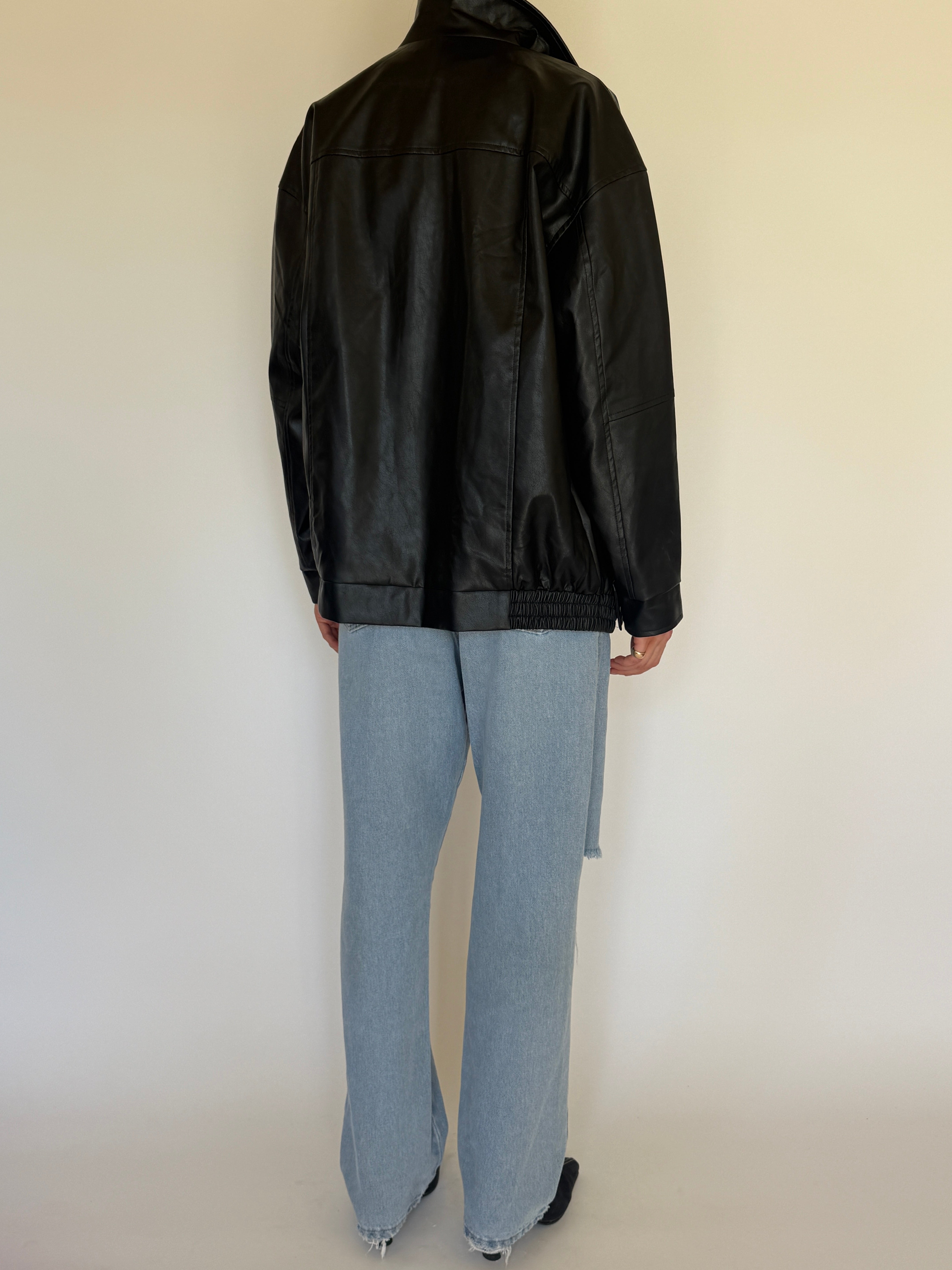 Vintage black faux leather jacket back view