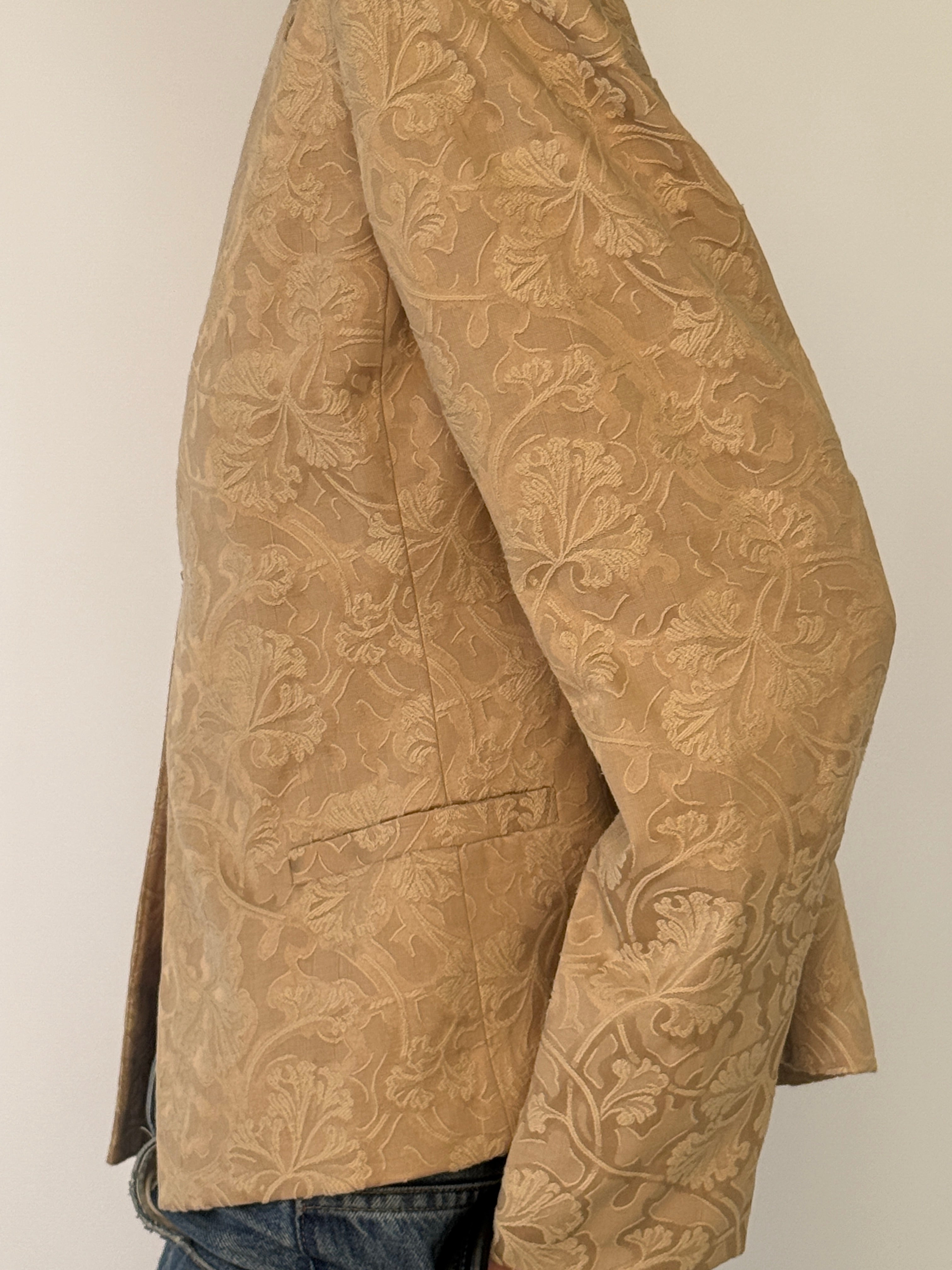 Vintage beige jacquard blazer close-up fabric detail