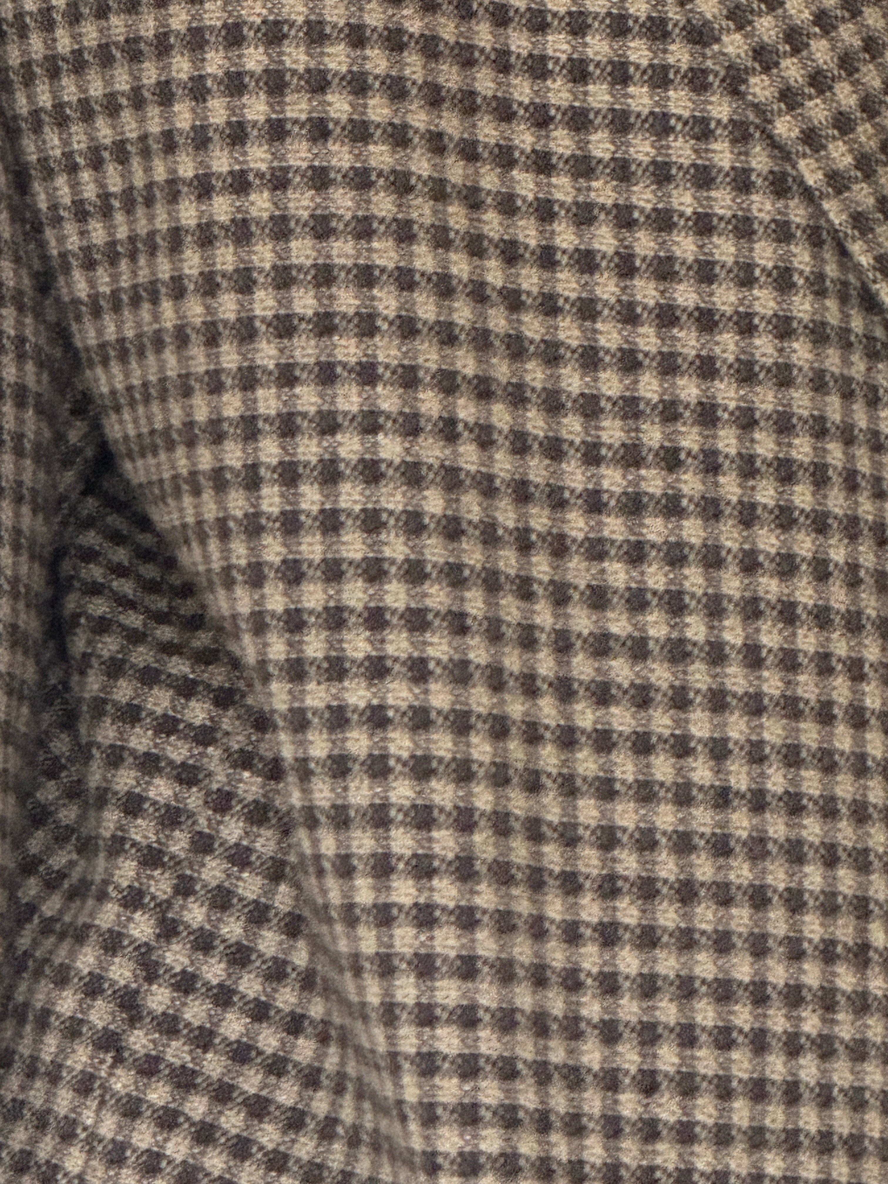 Close-up of the black and cream micro check woven fabric