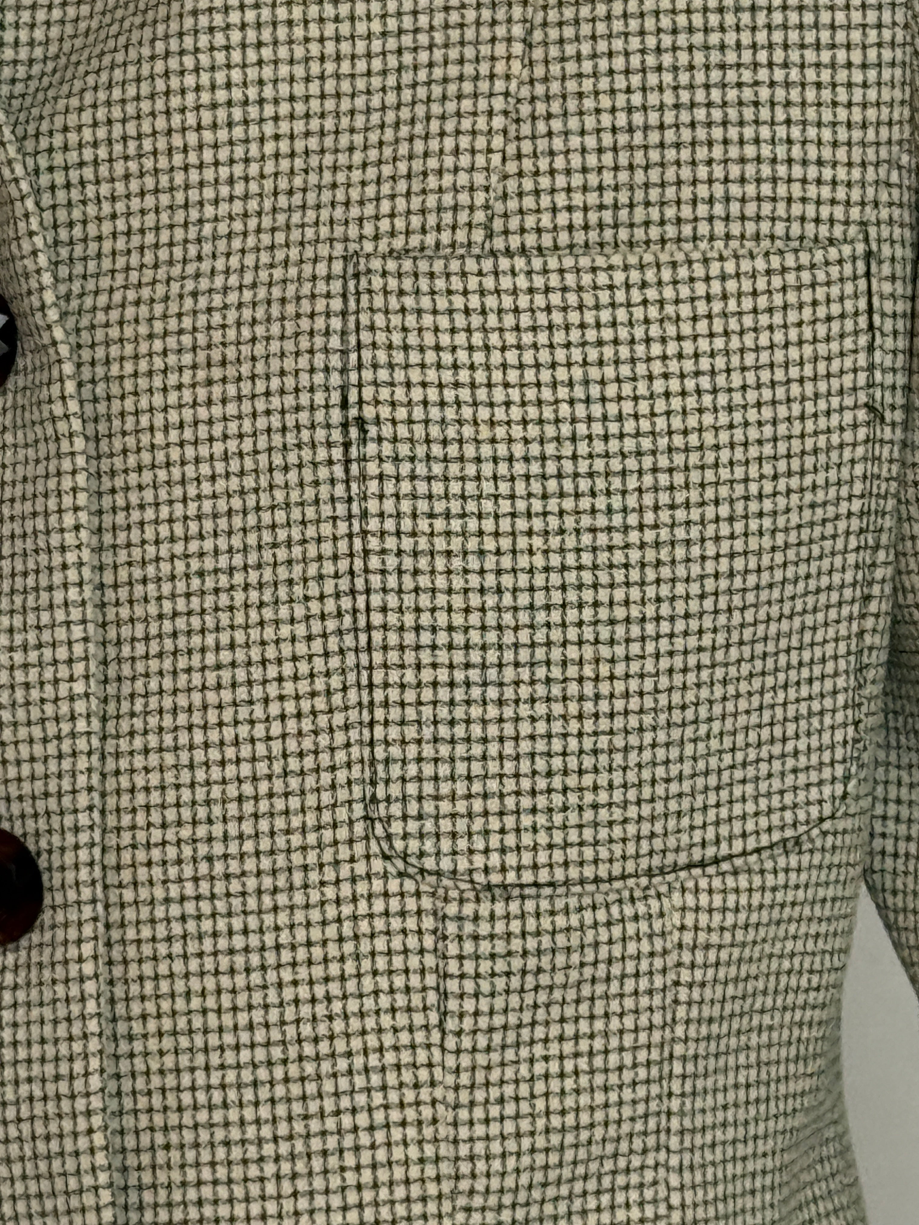 Vintage cream and black micro-check blazer fabric close-up pattern detail