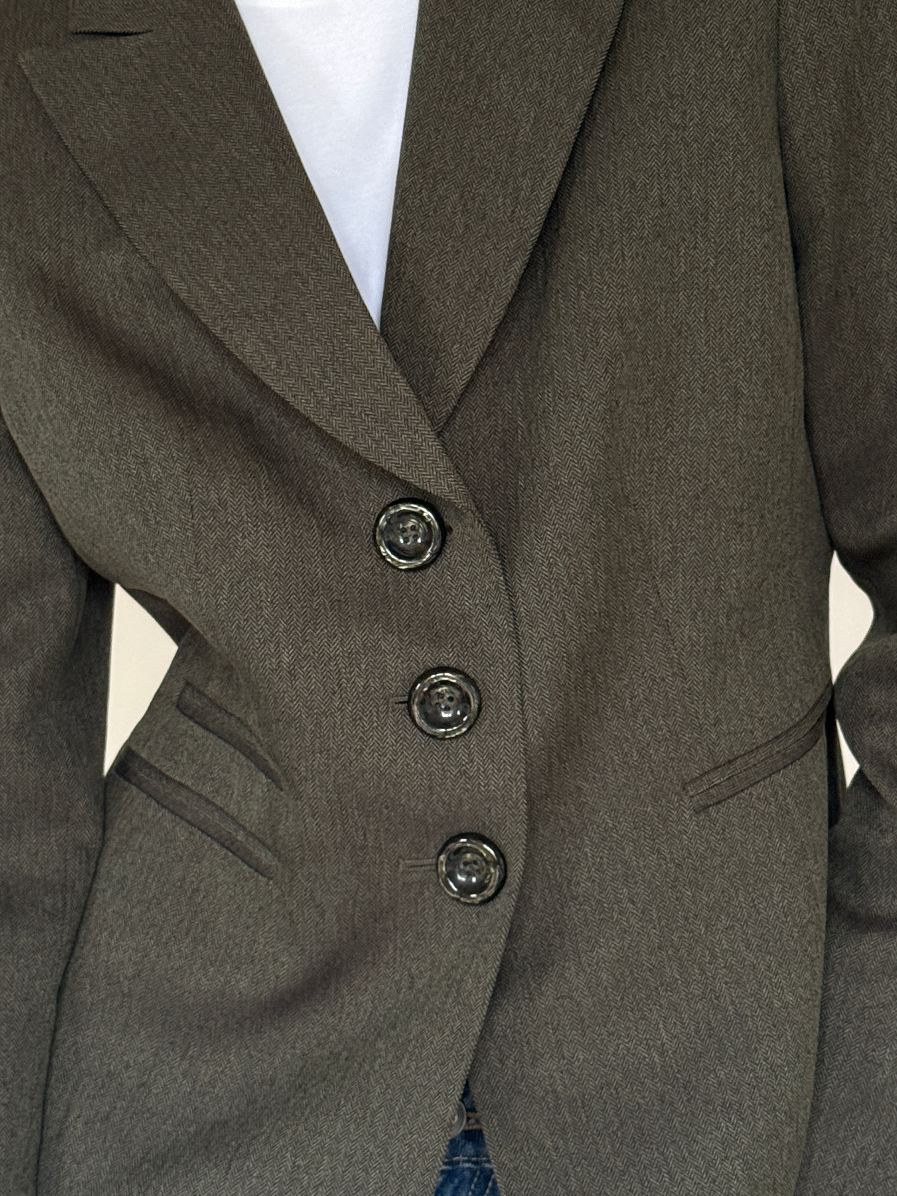 Vintage green and black herringbone fabric close-up