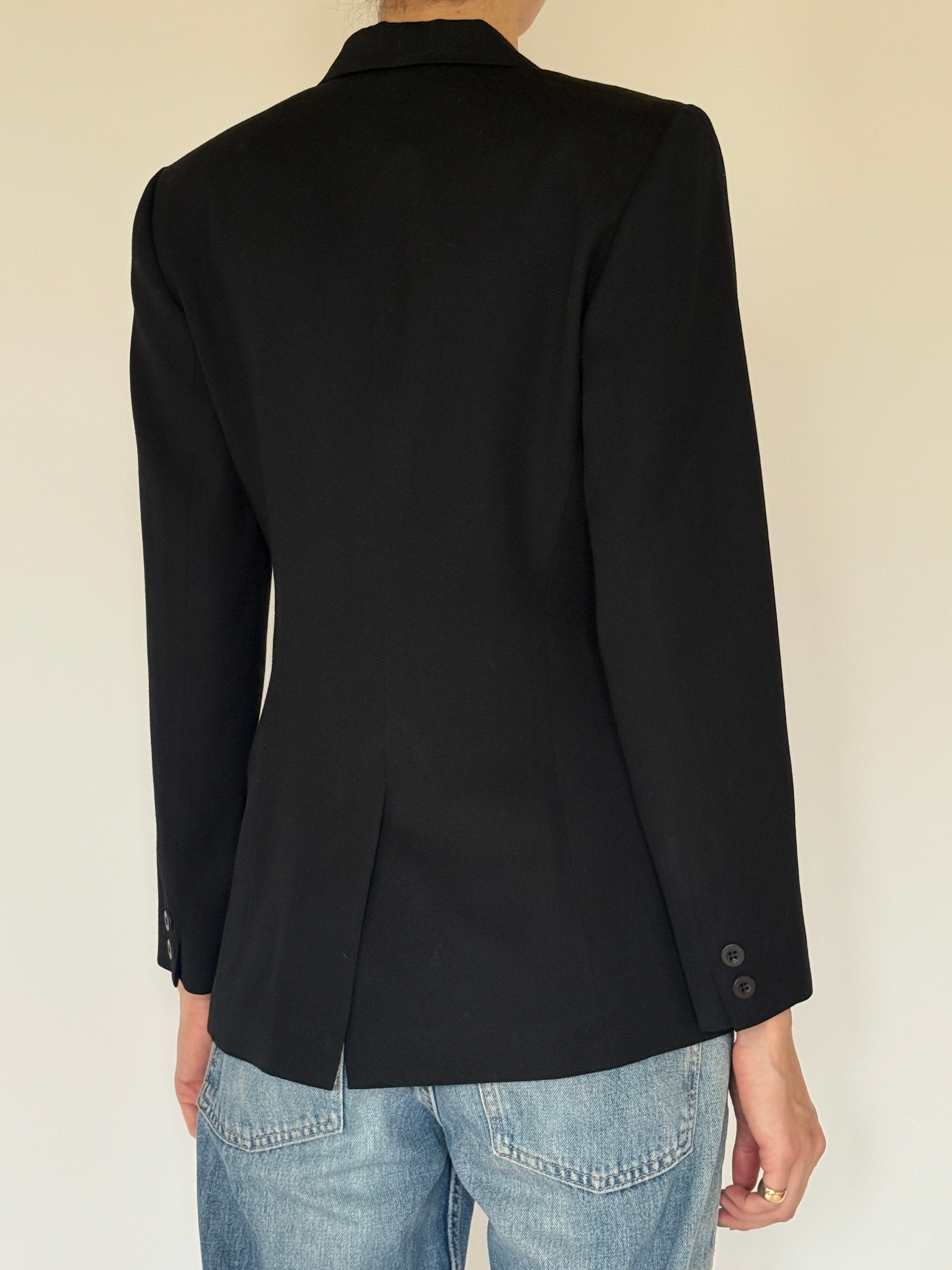 Vintage tailored black wool blazer close-up