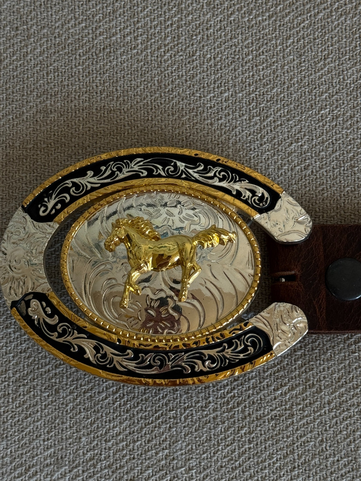 Vintage western belt ornate silver gold black horseshoe buckle close-up