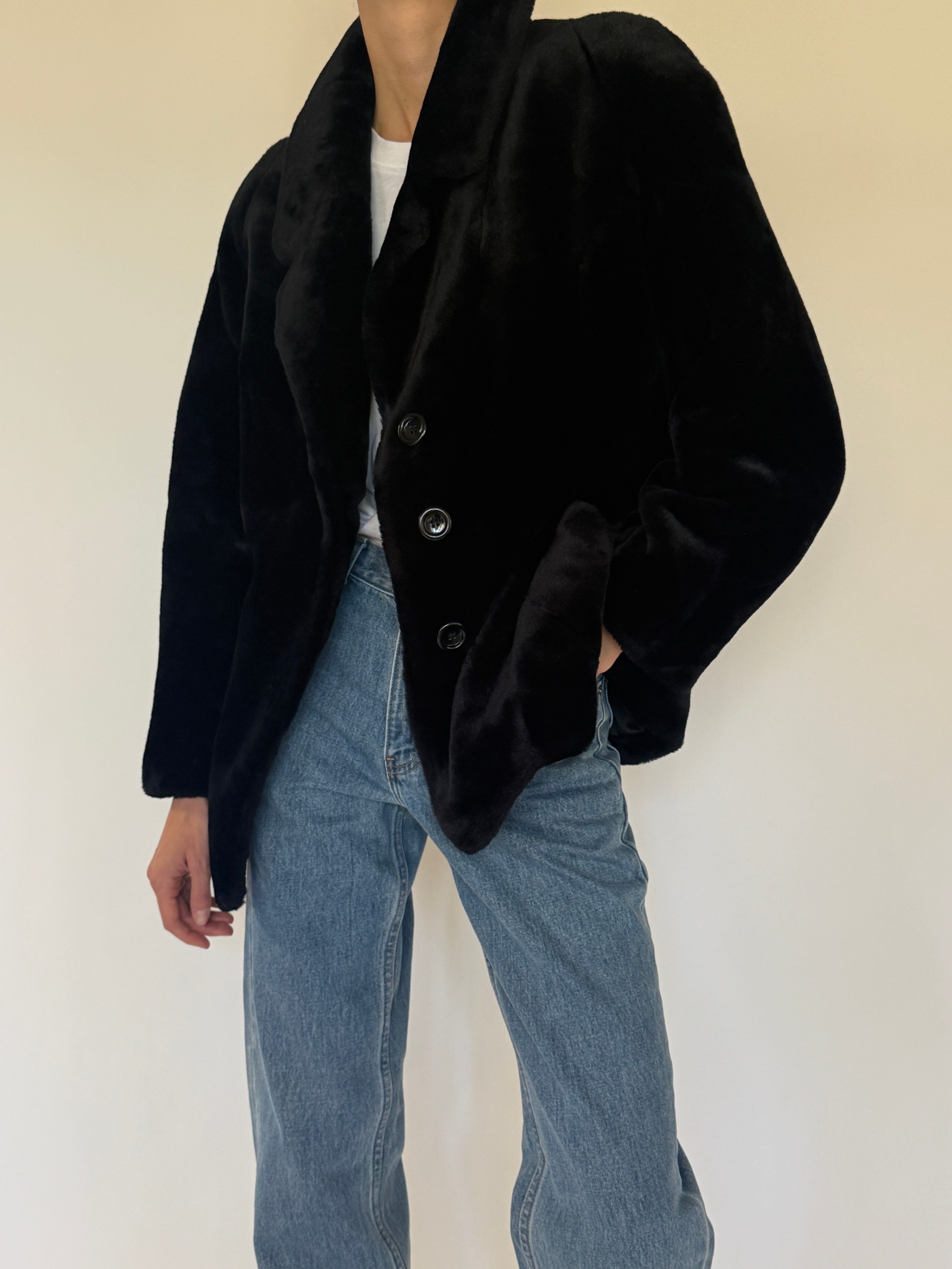 Vintage black faux fur coat fur texture close-up