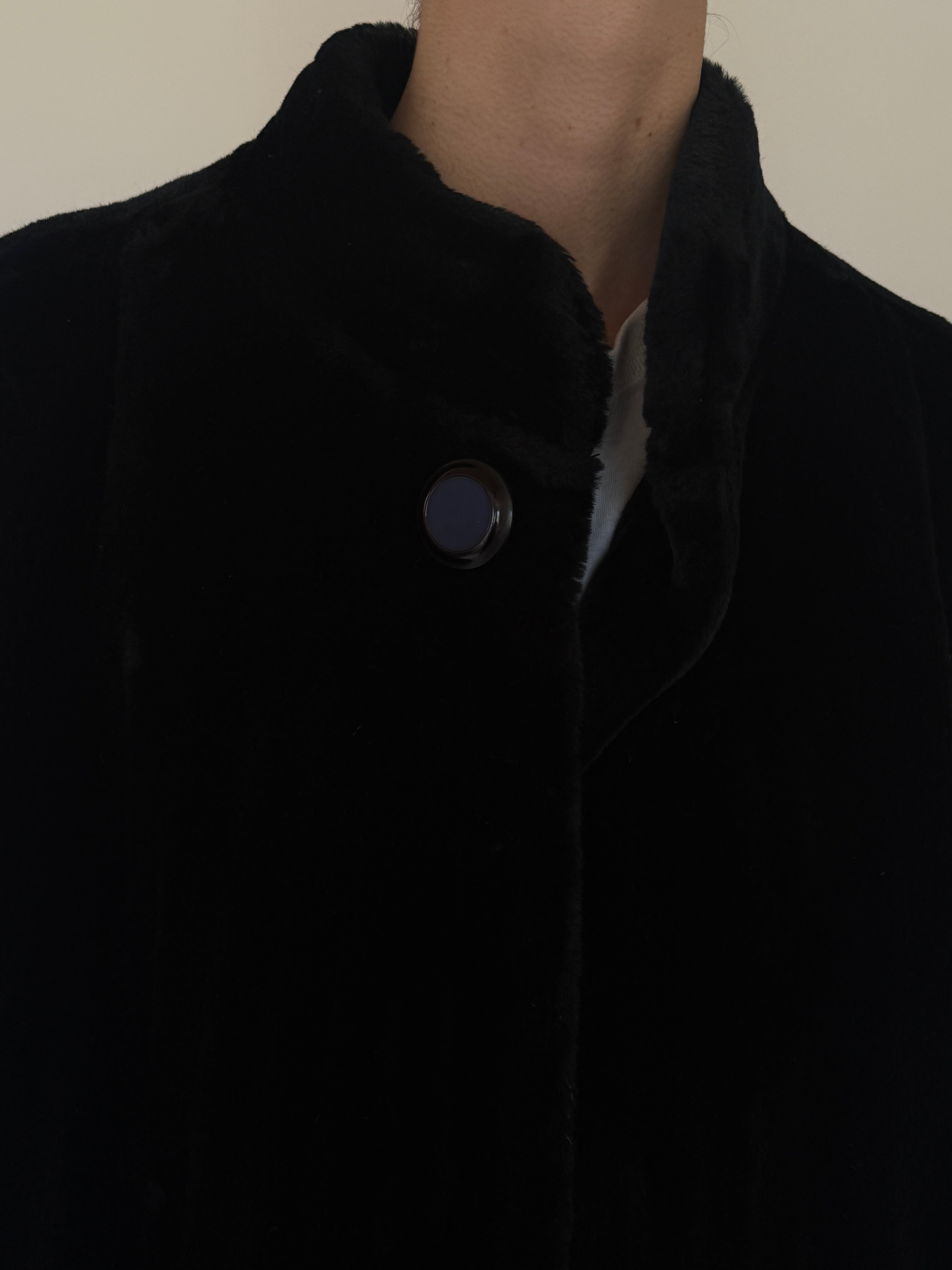 Vintage black faux fur coat fabric close-up