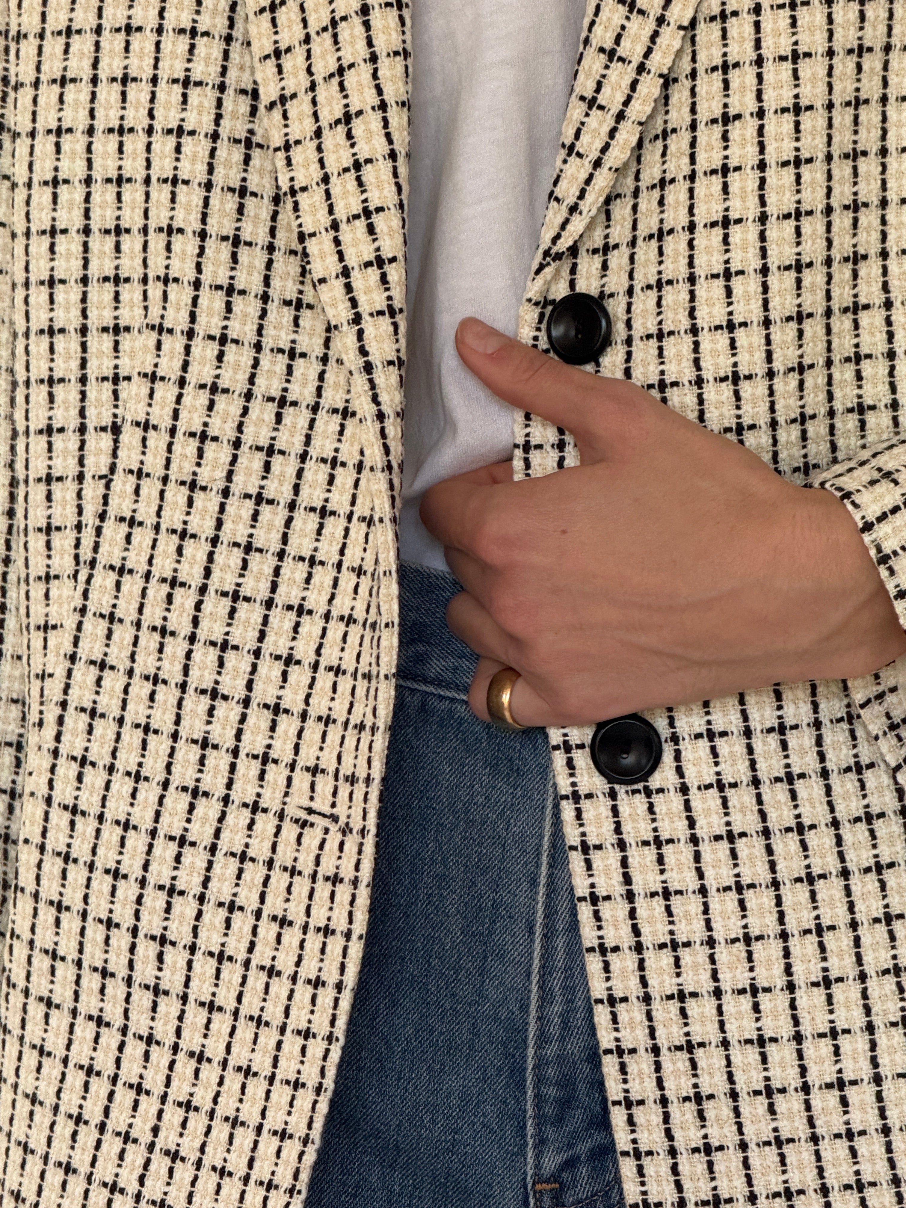 Vintage cream and black tweed blazer weave close-up