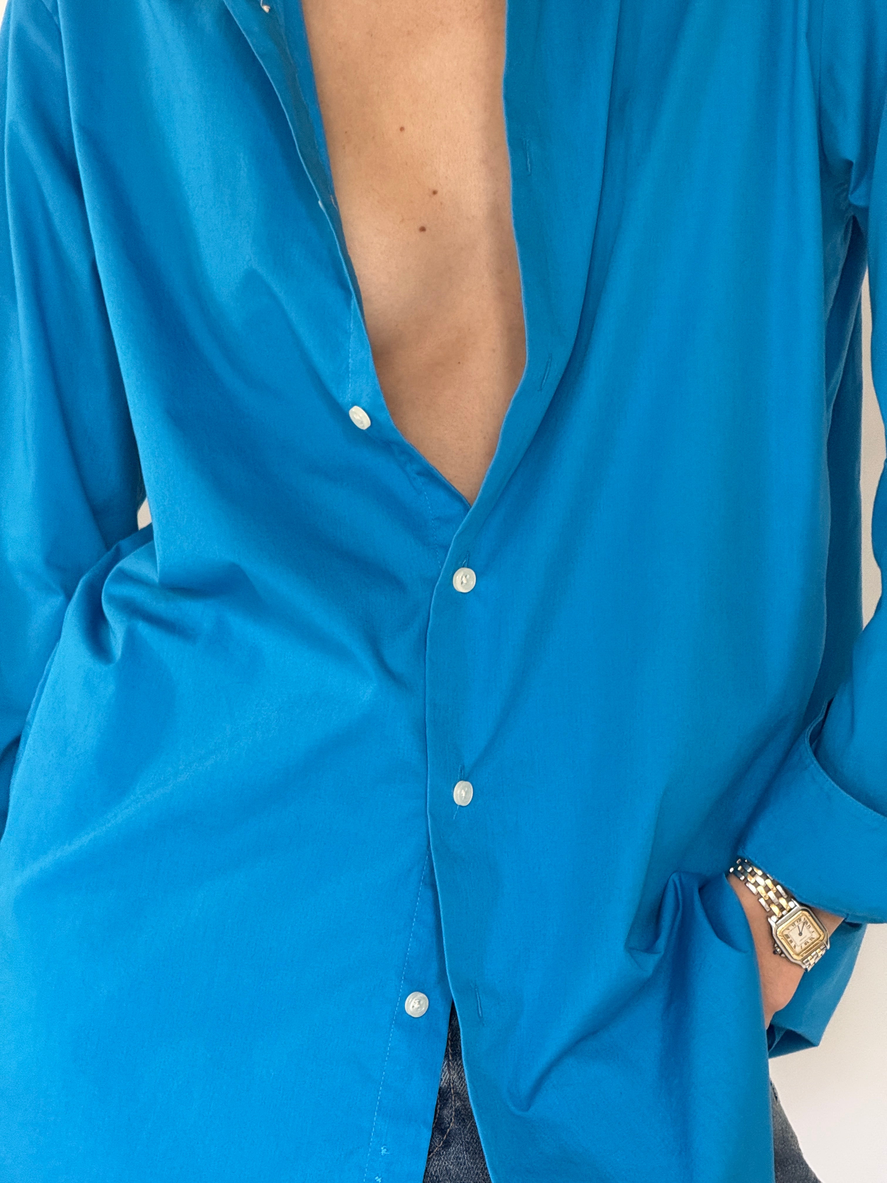 Vintage blue shirt button detail close-up