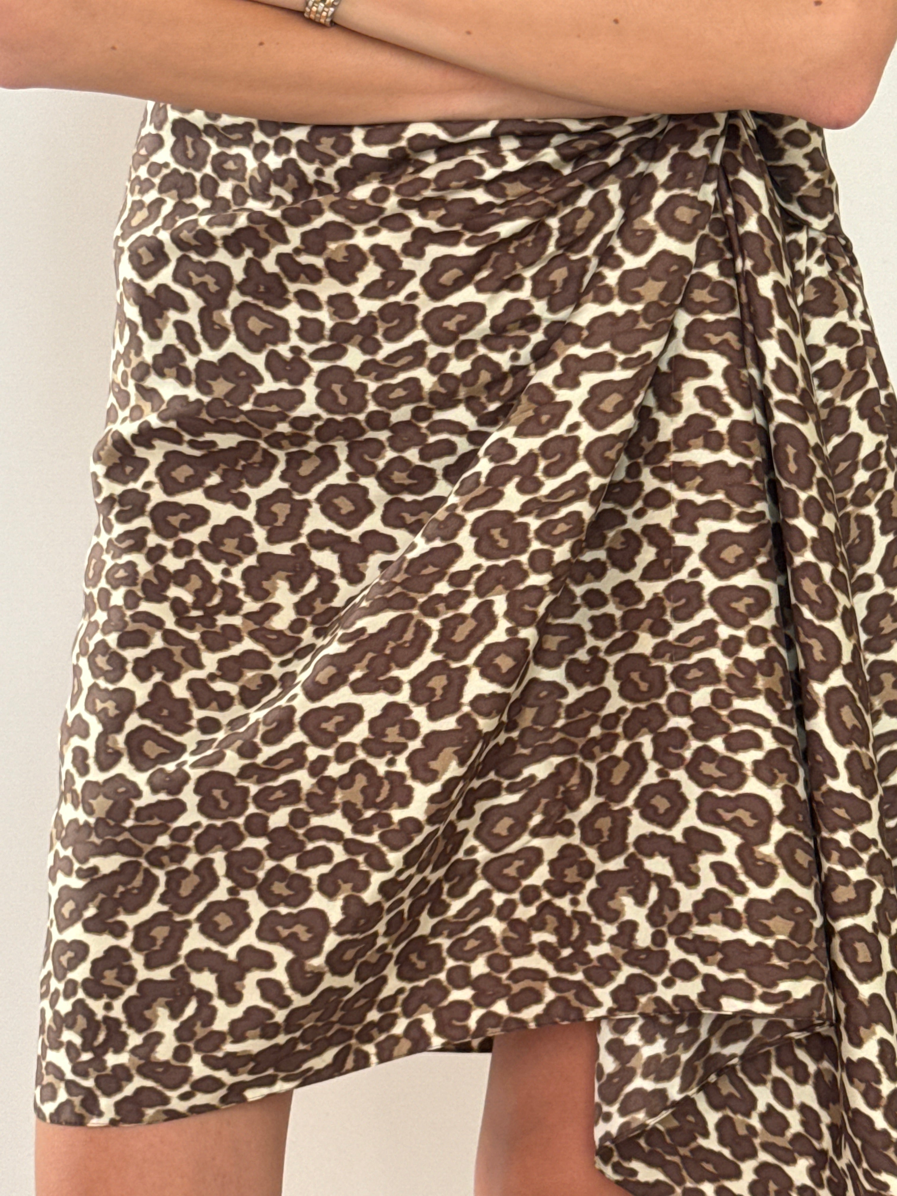 Close-up of leopard print fabric and raw/frayed hem edge