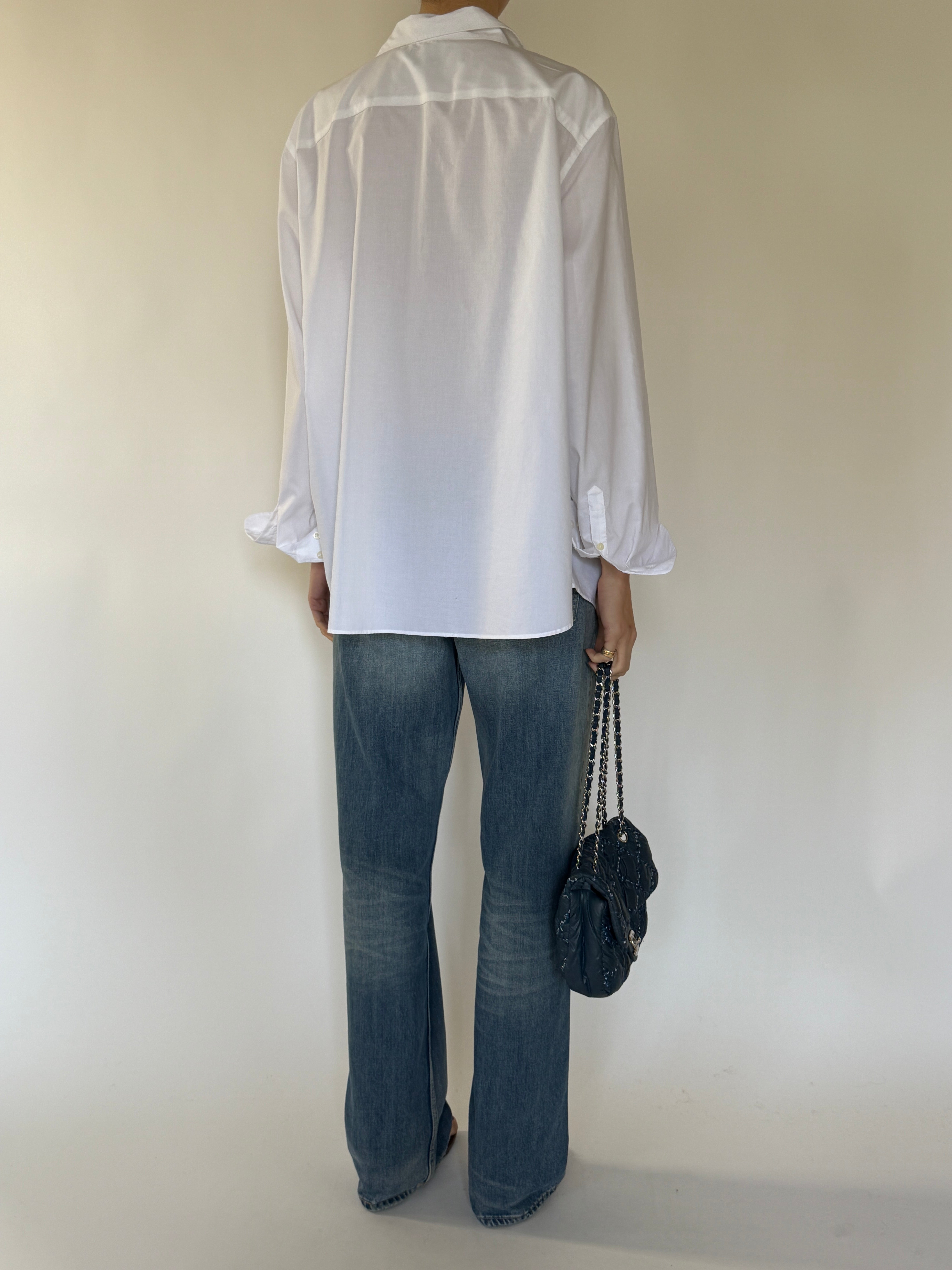 Vintage relaxed white button-up shirt styled with denim