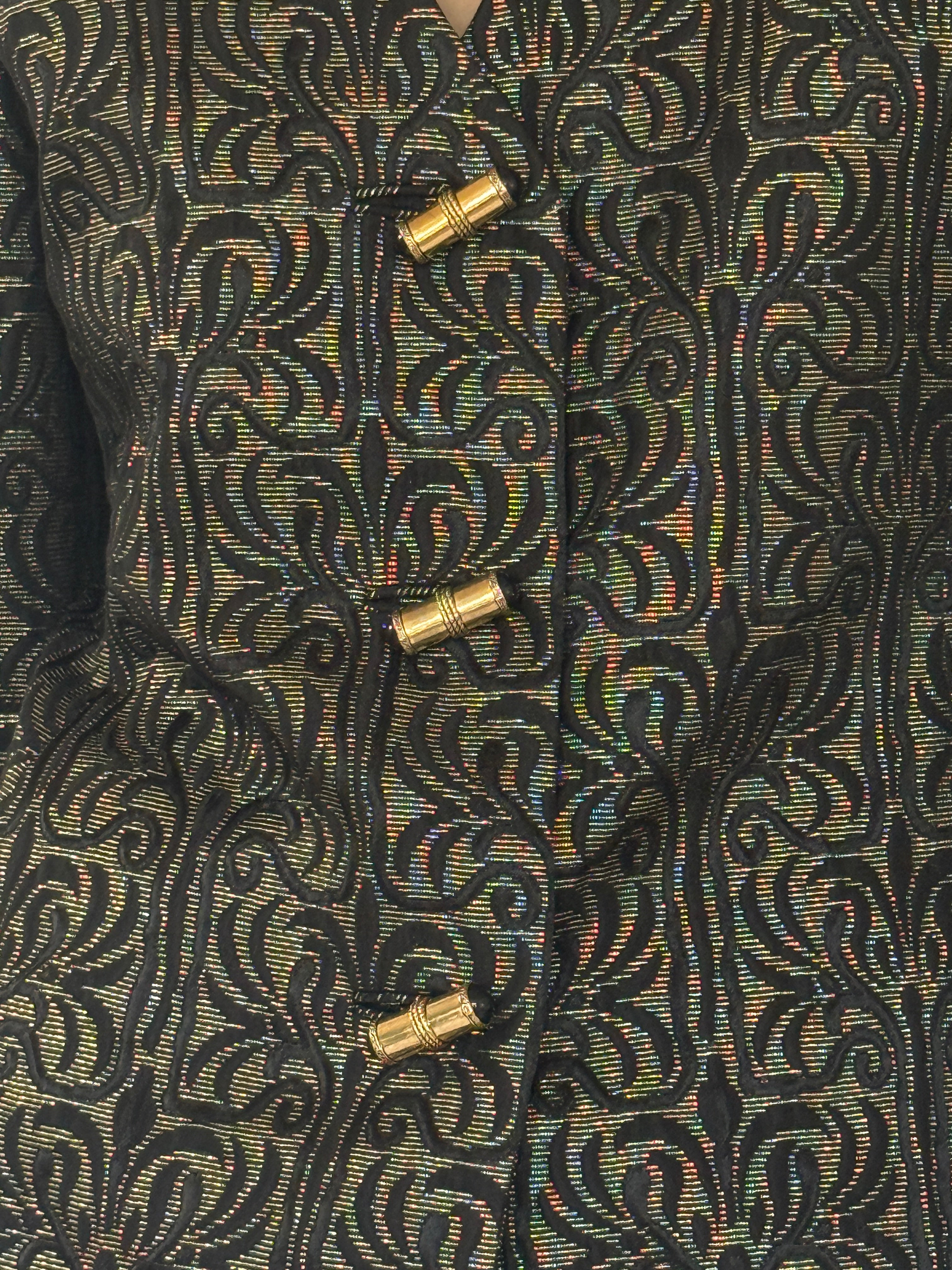 Vintage metallic jacquard fabric close-up black gold