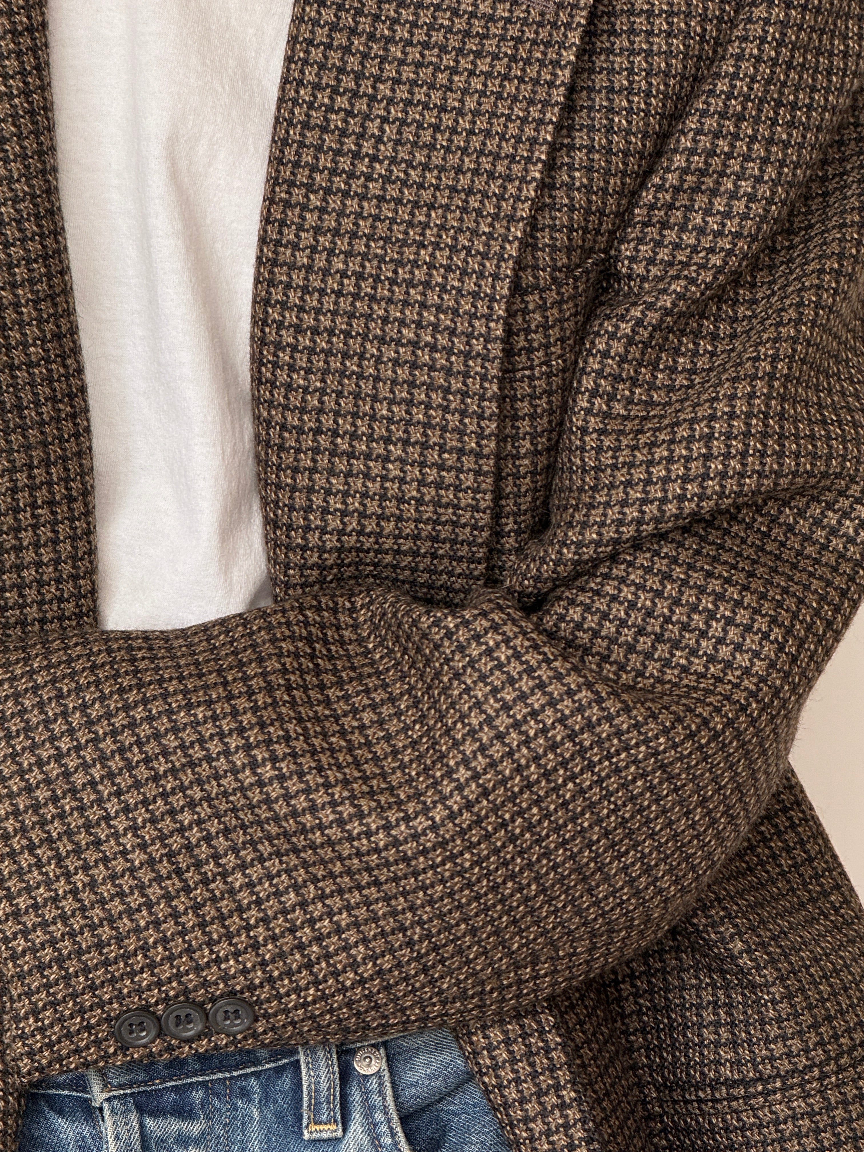 Close-up of vintage houndstooth wool blazer texture