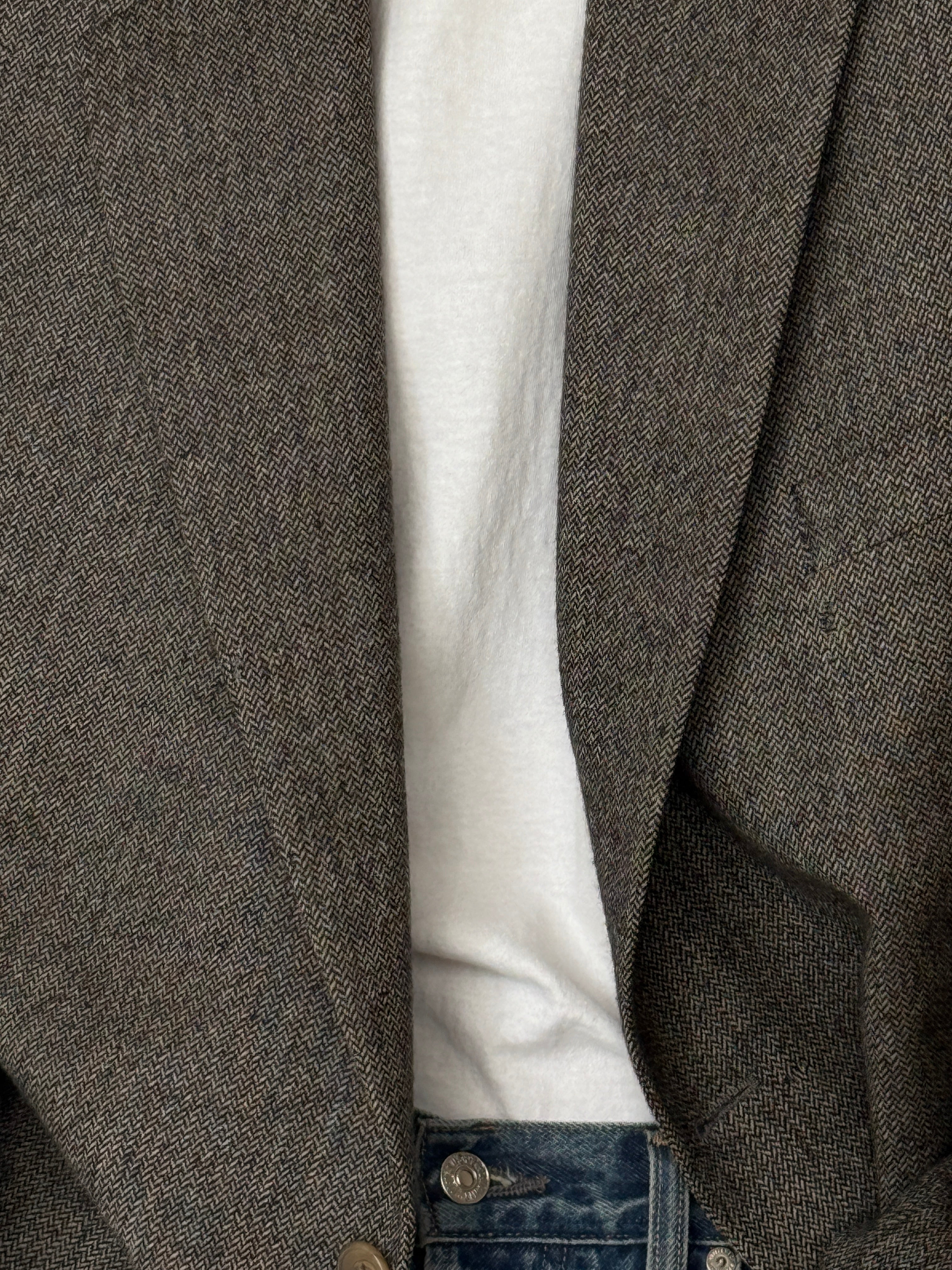 Vintage grey herringbone blazer fabric close-up