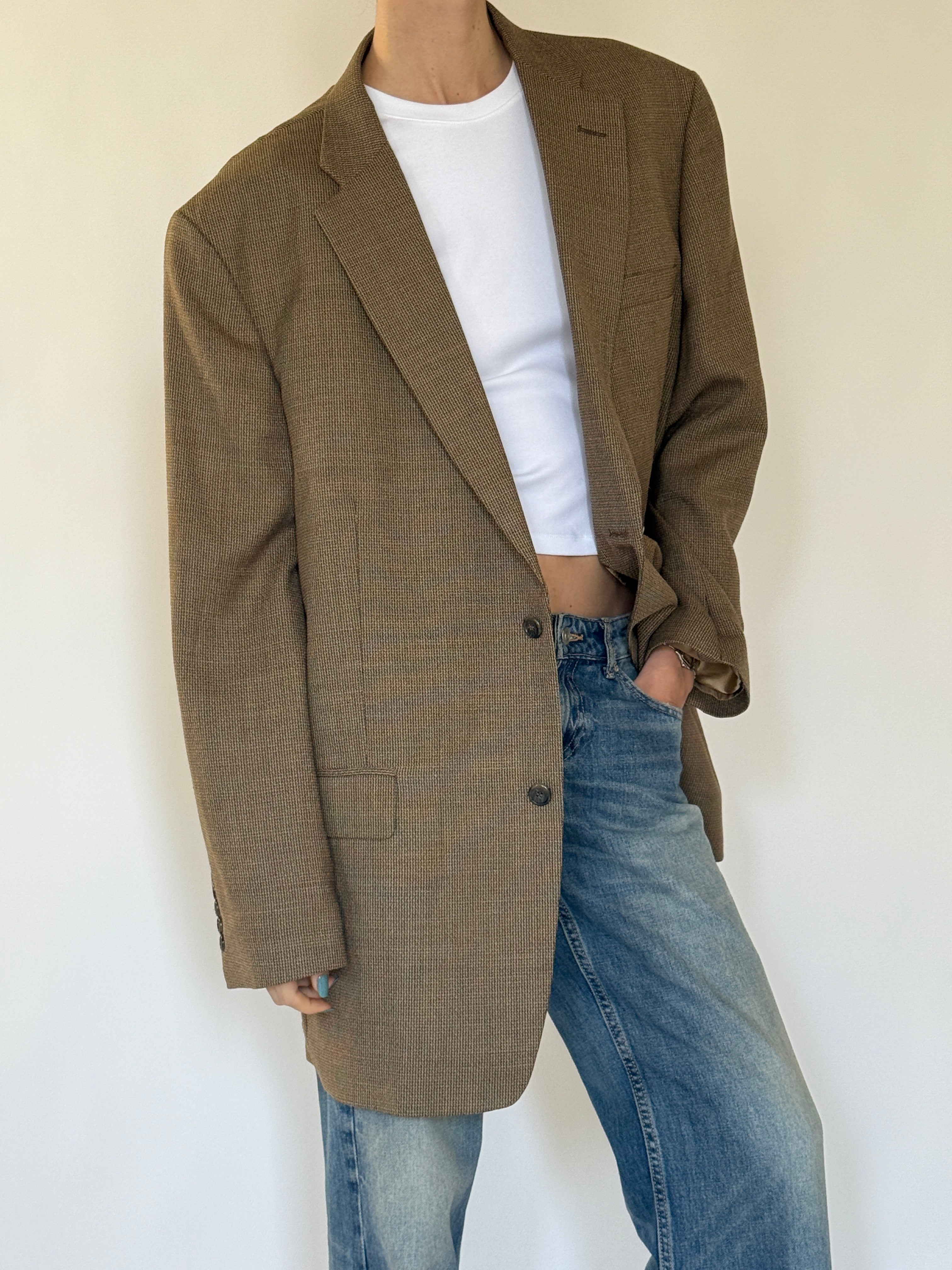 Vintage brown textured blazer close-up fabric detail