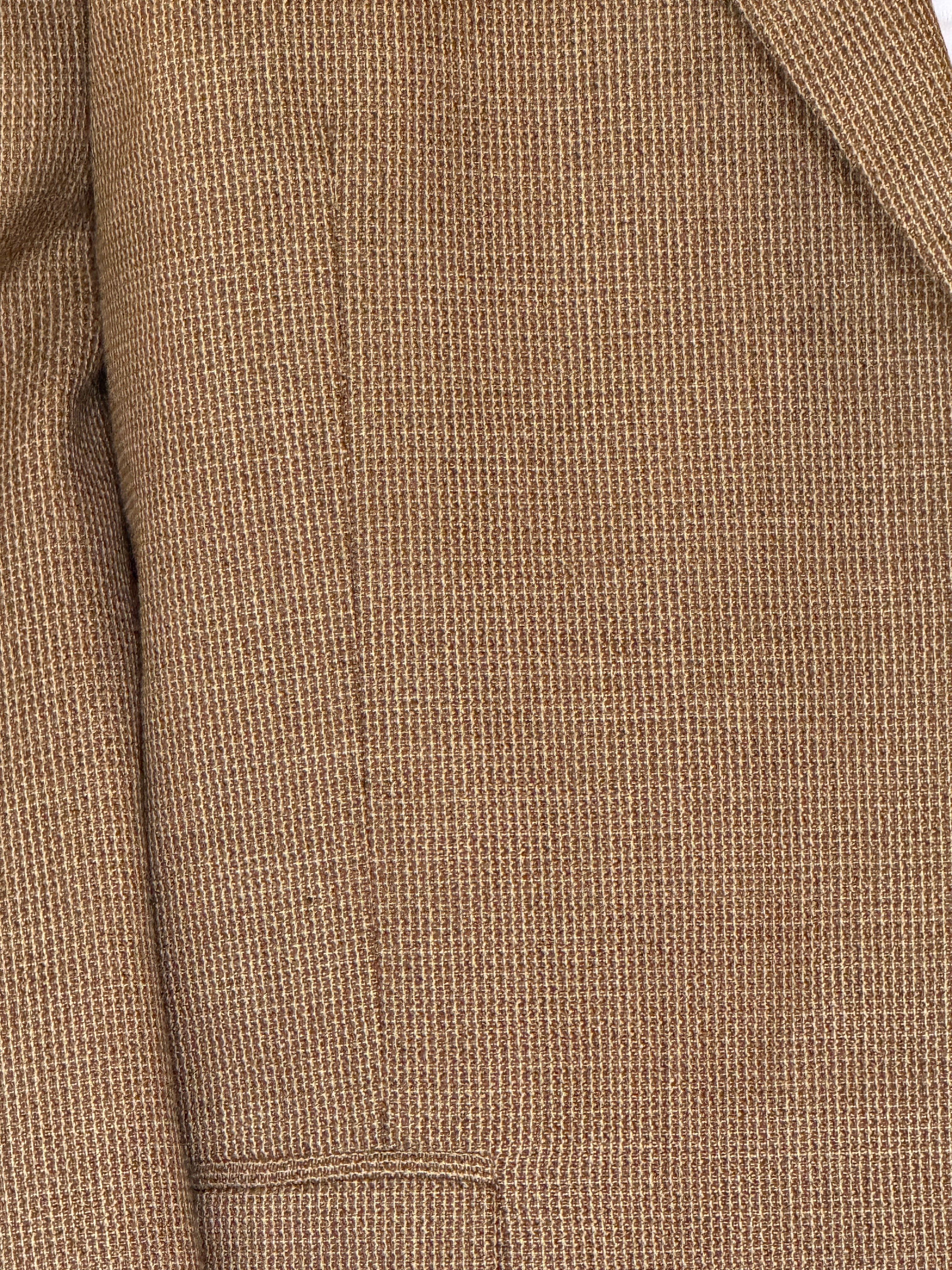 Vintage brown textured blazer close-up fabric detail