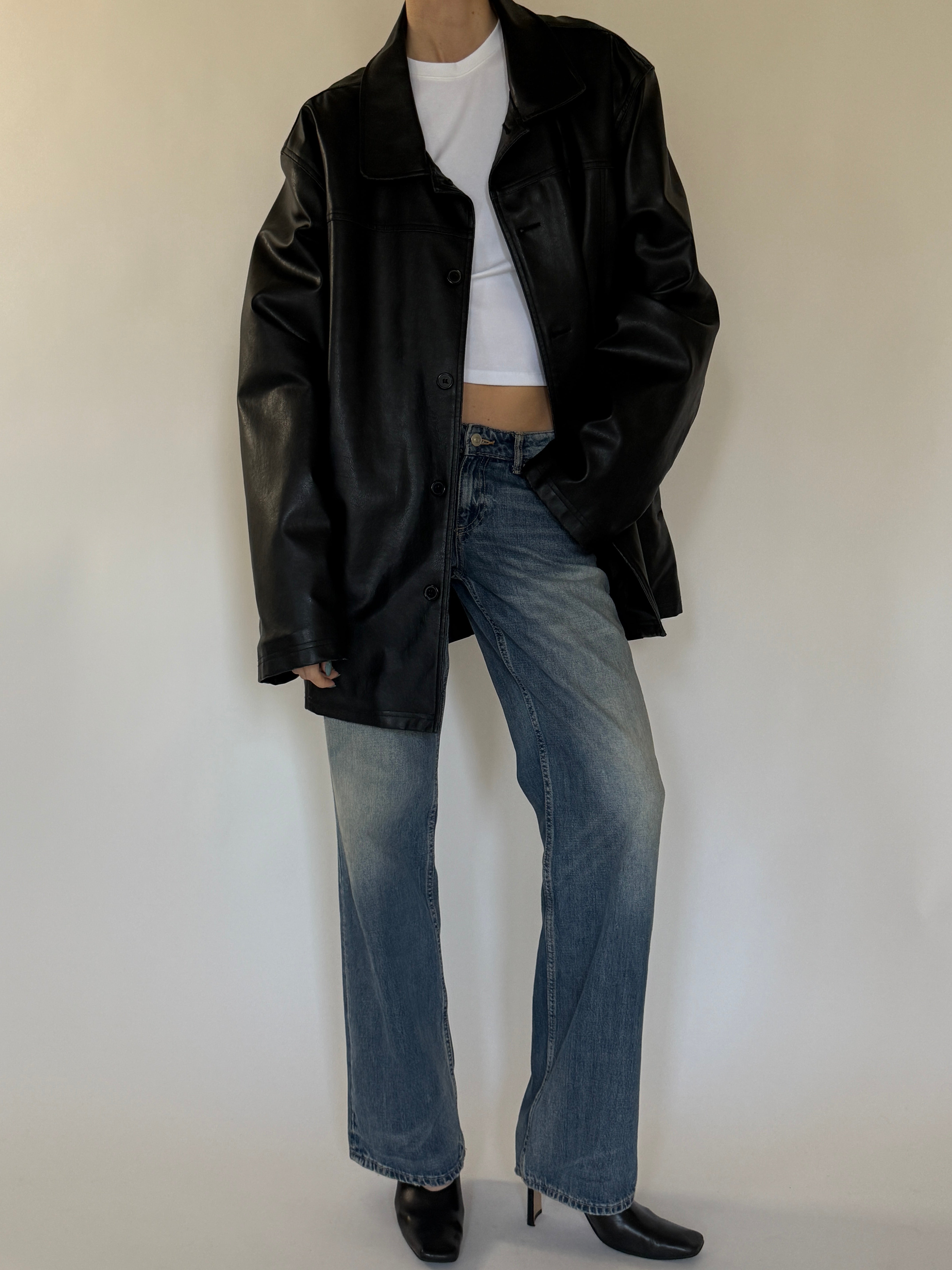 Vintage leather jacket with front button closure detail