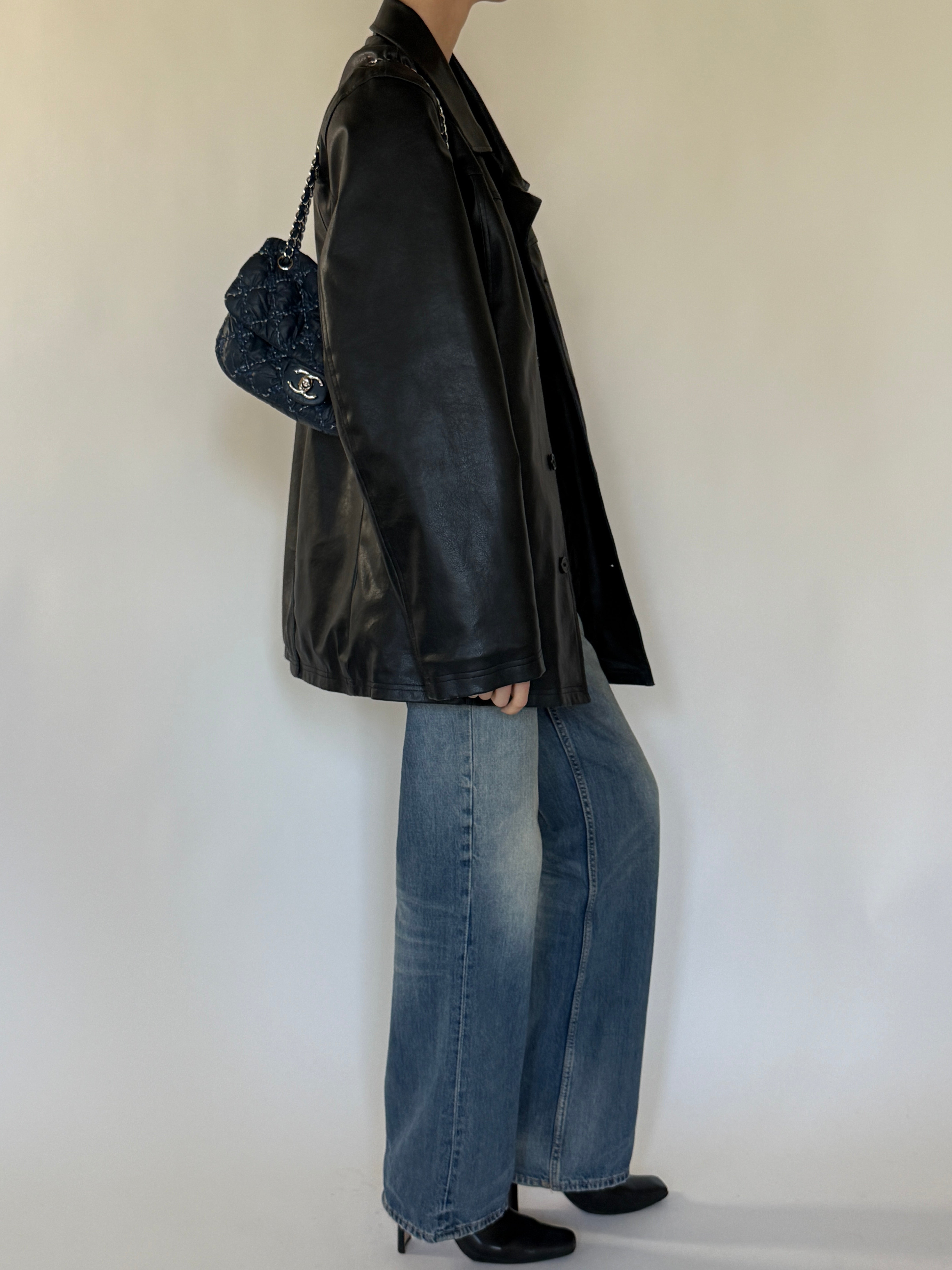 Vintage black leather jacket side profile view