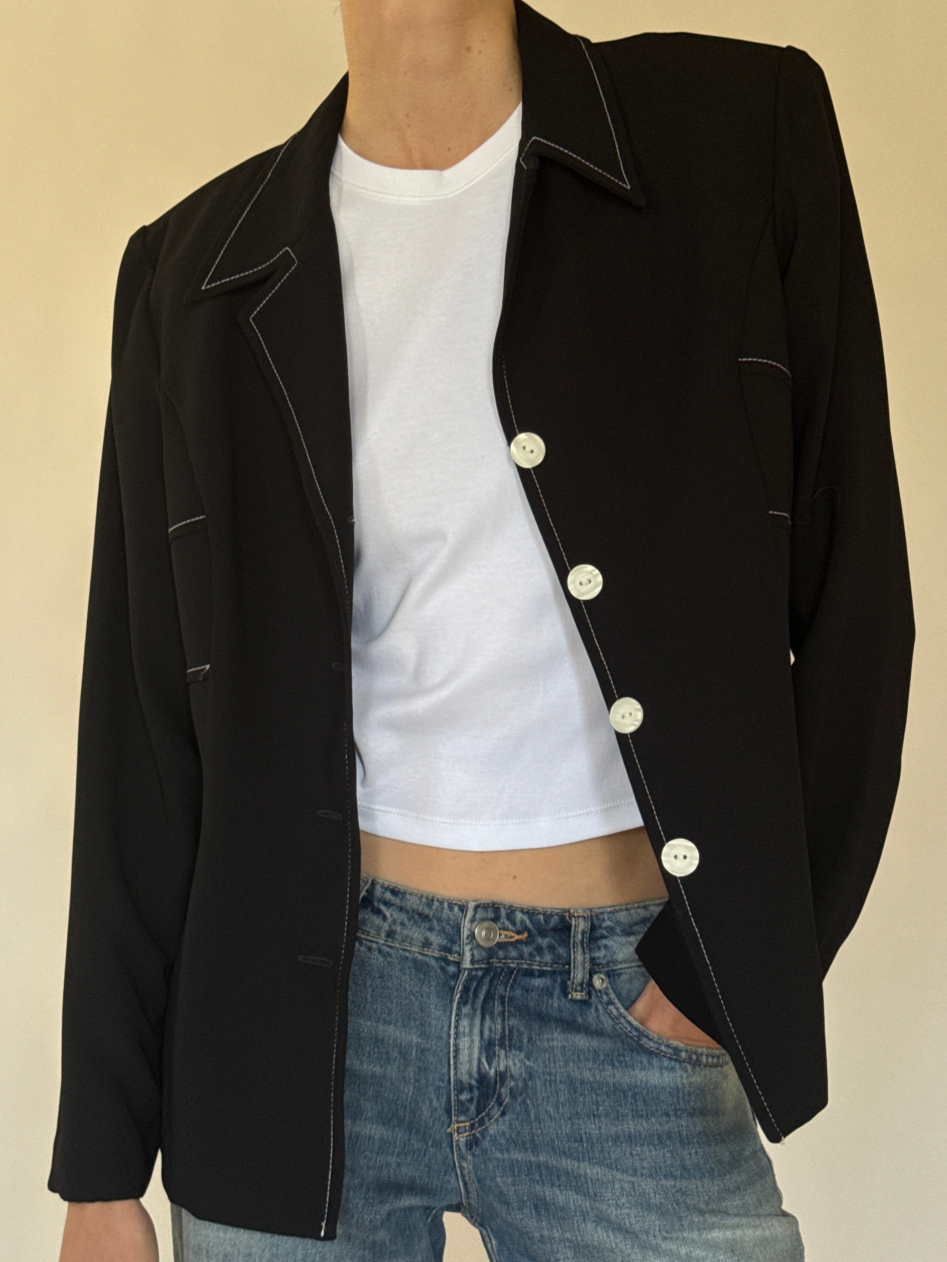 Vintage black blazer fabric close-up