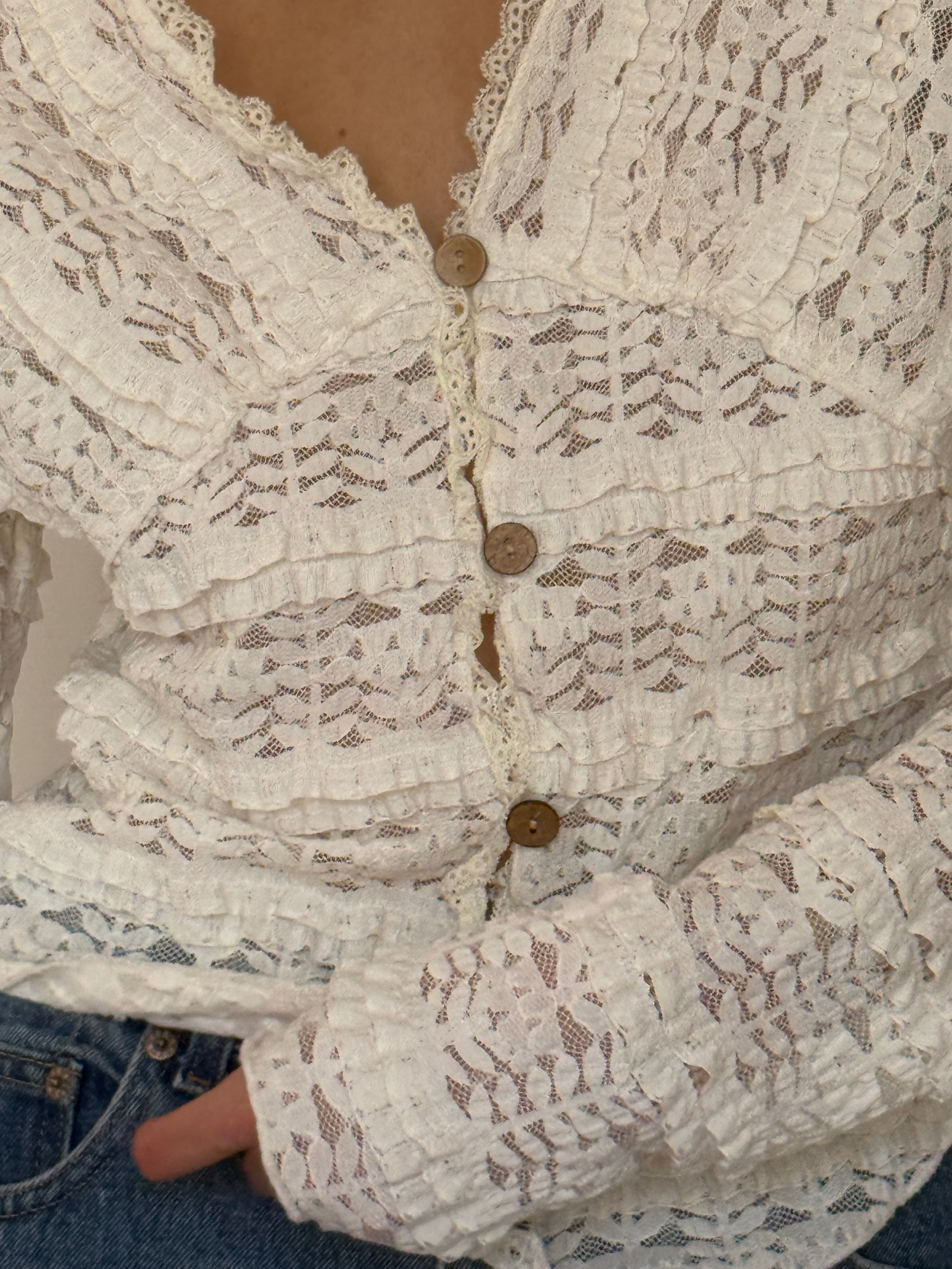 Vintage ivory lace ruffle blouse fabric close-up