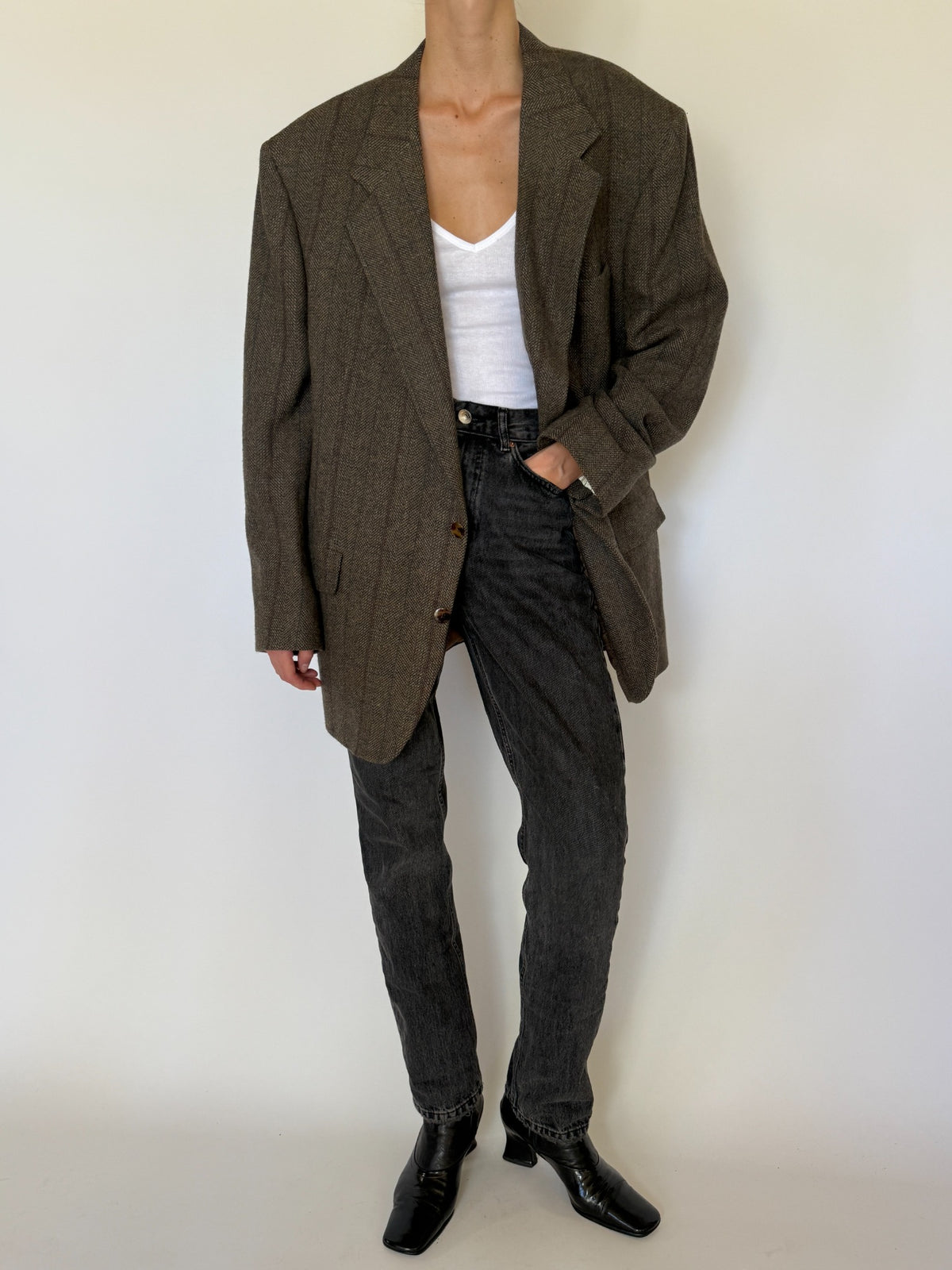 Front view of brown herringbone wool blazer