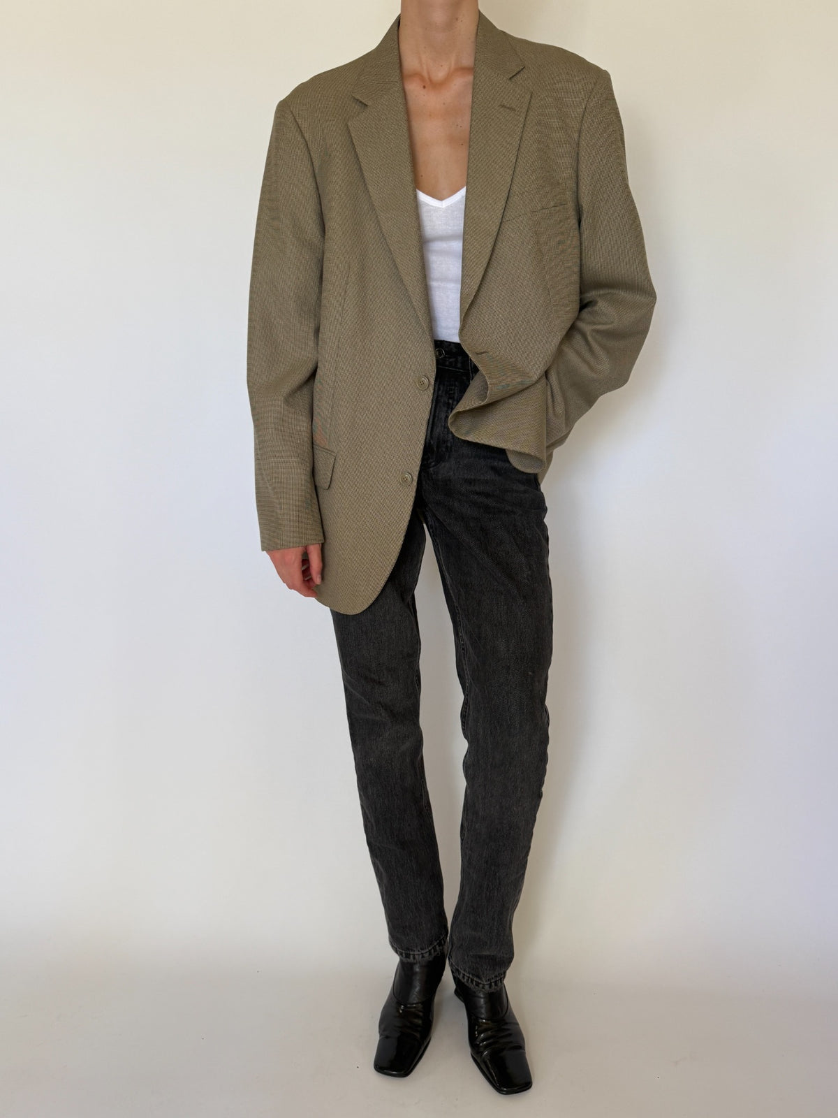 Front view of vintage oversized beige micro check blazer